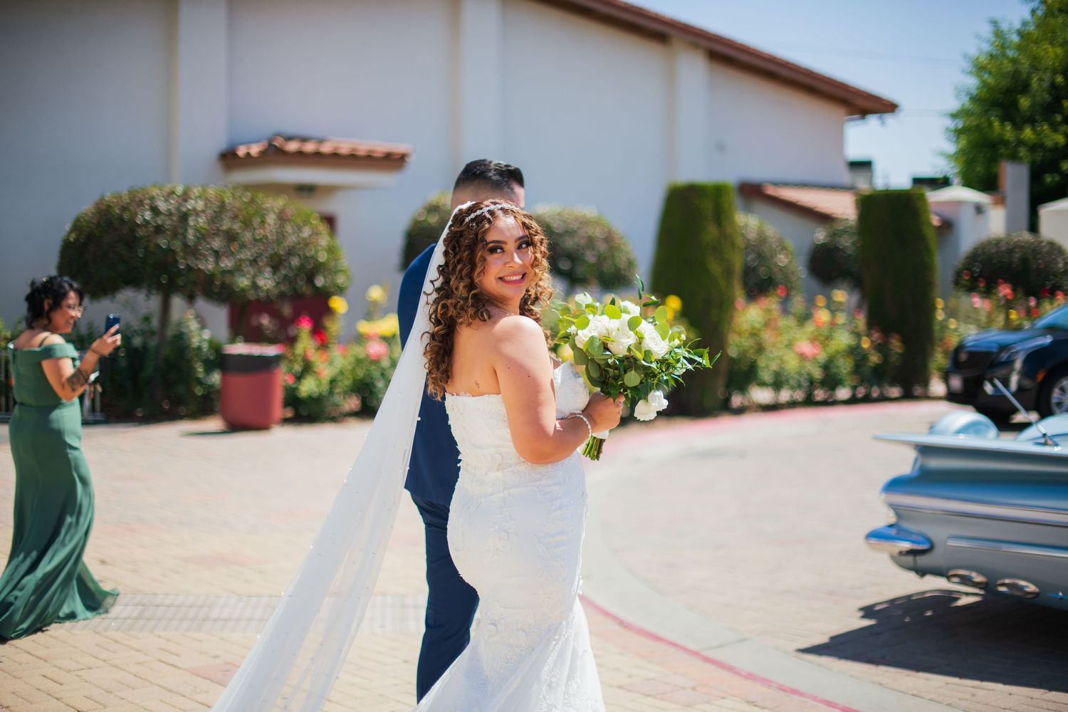 Sunny outdoor wedding venue with Our Lady of Guadalupe Catholic Church El MonteSpanish-style architecture and palm trees.