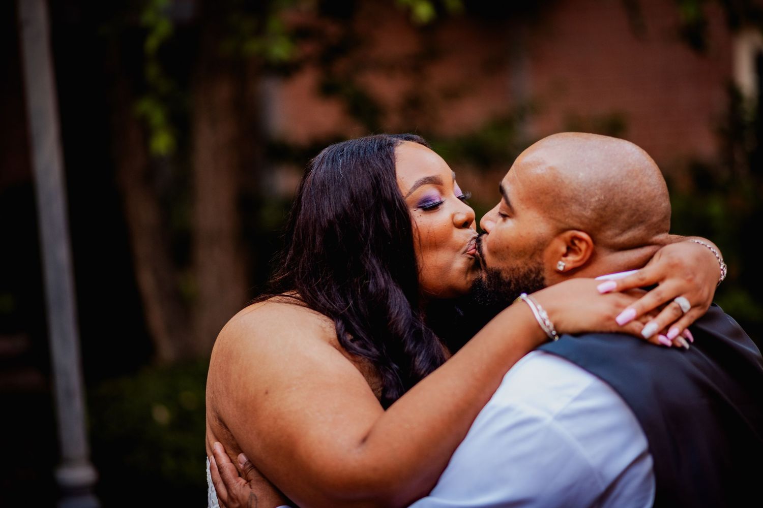 Romantic outdoor portrait session with couple in wedding attire.