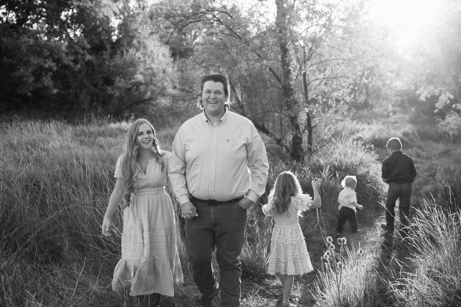 Black and white vintage photographs arranged in a horizontal collage showing family moments outdoors.