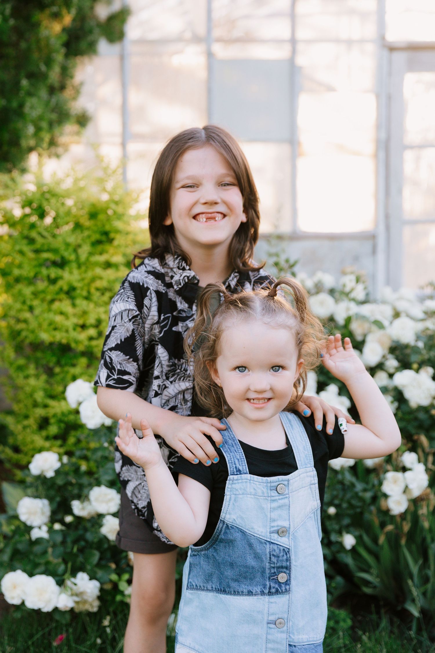 Series of candid photos showing joyful moments and laughter in a garden with white flowers.