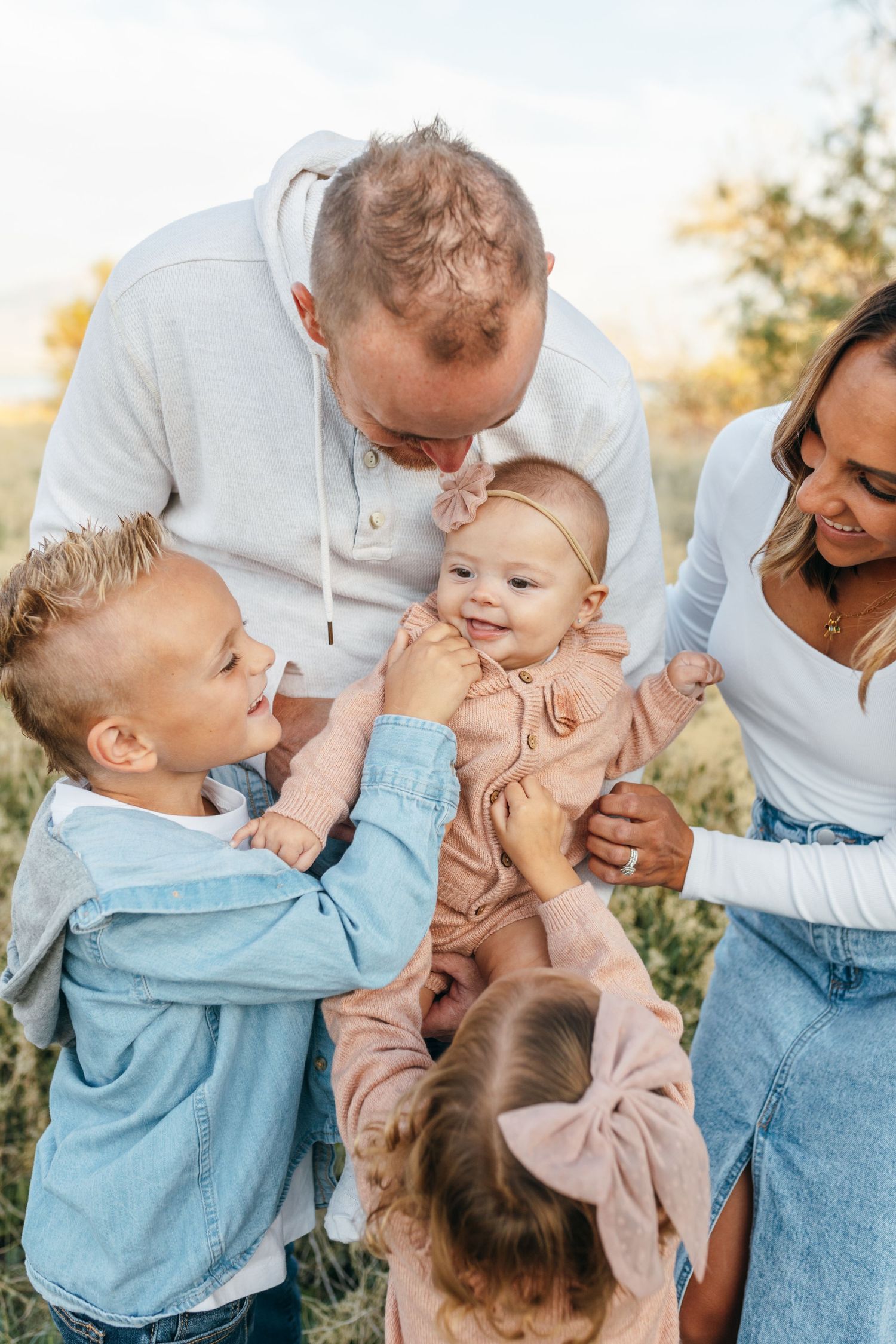 Playful family interactions captured in a series of candid moments outdoors.