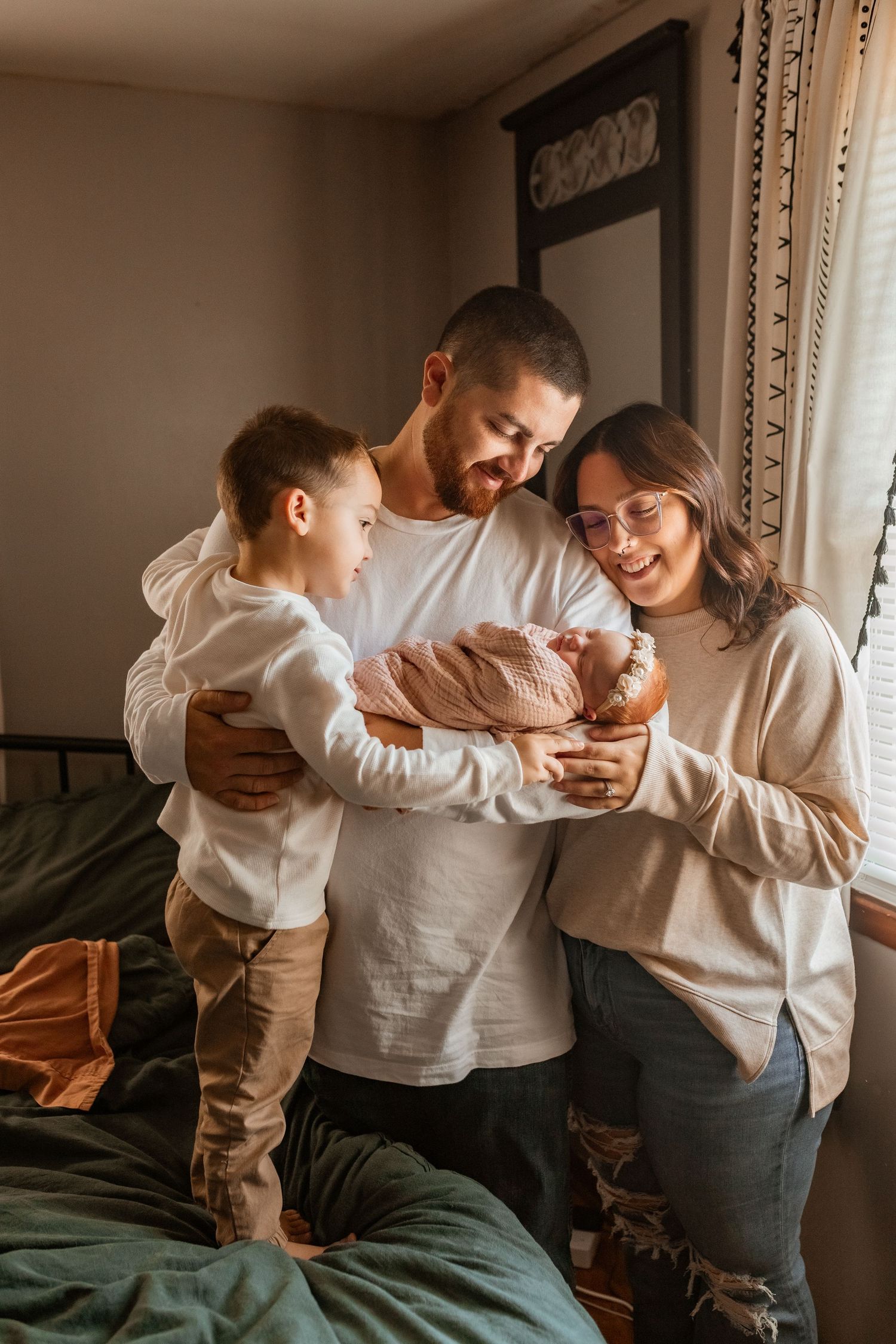 A playful sequence of candid moments showing family members laughing and embracing on a bed in warm lighting.