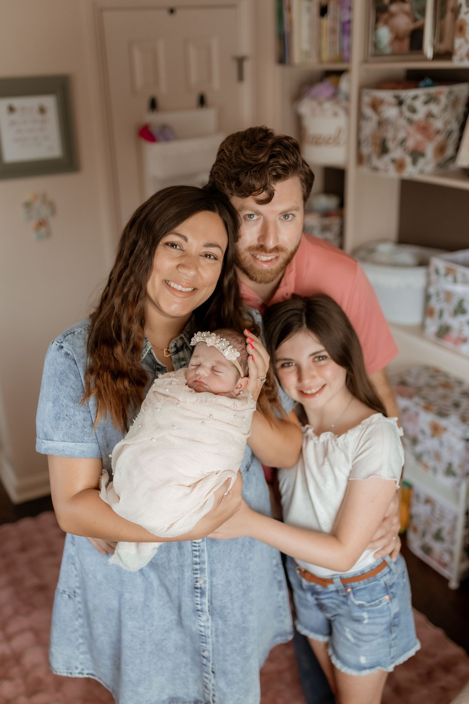 Family portrait session in casual denim outfits showing tender moments together.