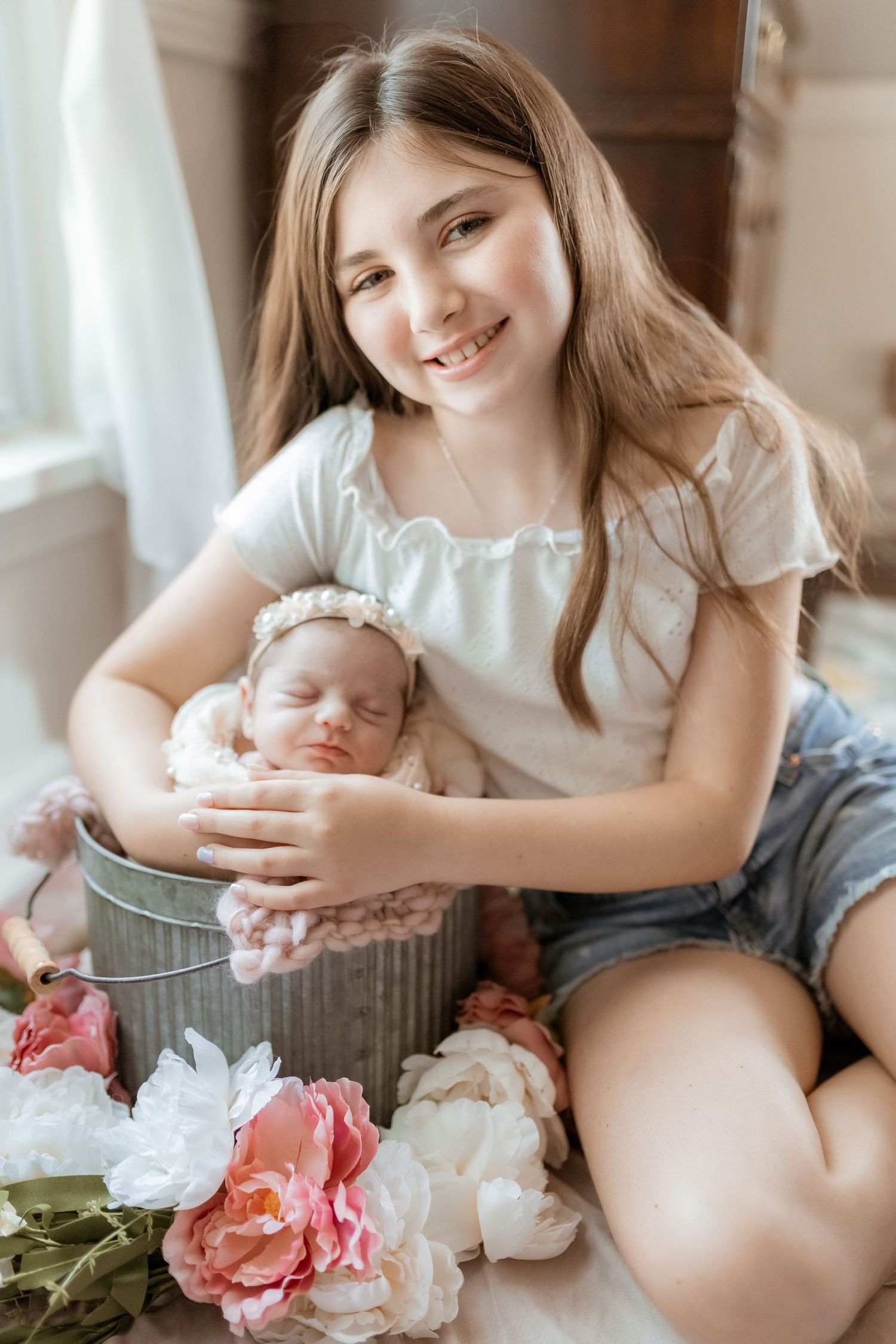 A series of intimate lifestyle photos showing a baby with floral decorations in soft, natural lighting.