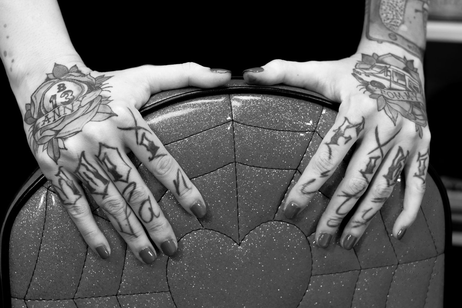A series of black and white photos showing hands adjusting and positioning a camera lens.