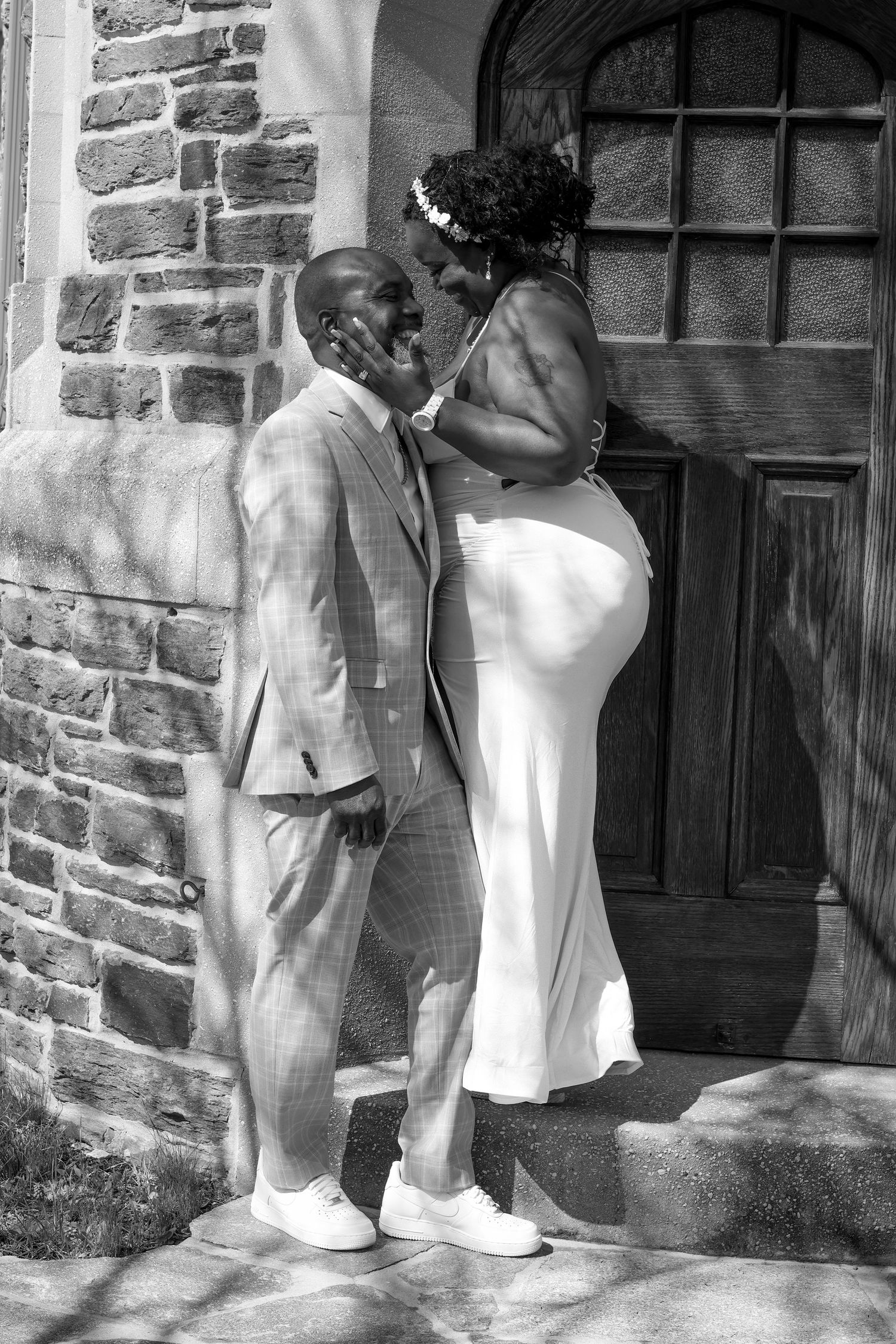 A series of black and white photos showing people standing in front of a stone building entrance.