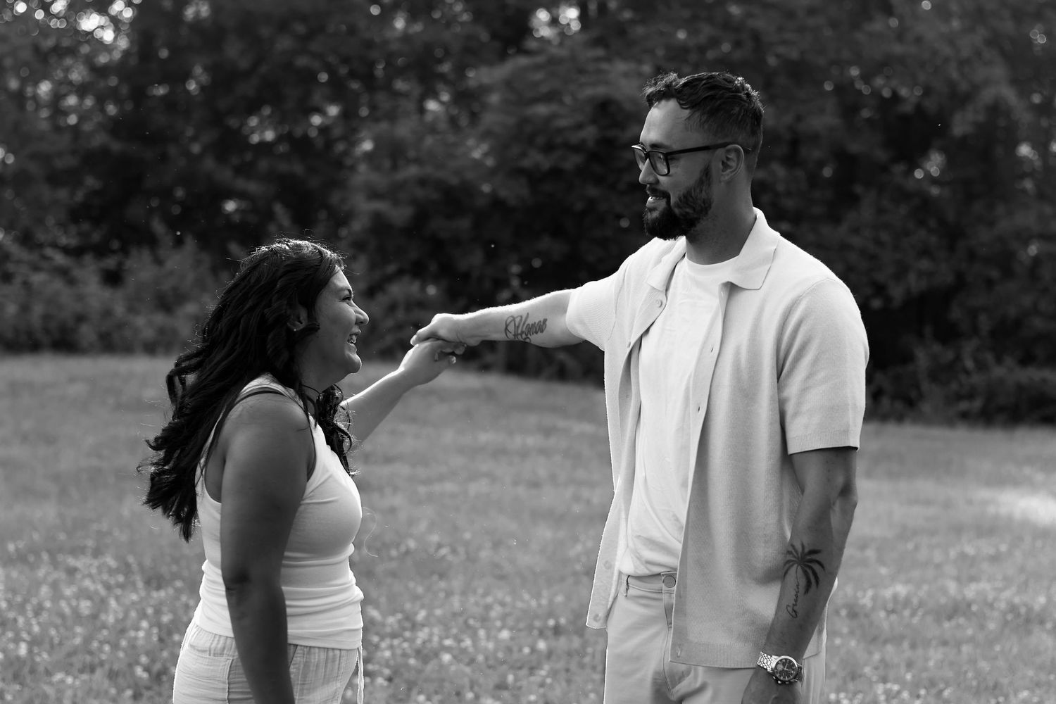 A black and white photo sequence shows a couple walking and dancing together in a park setting.