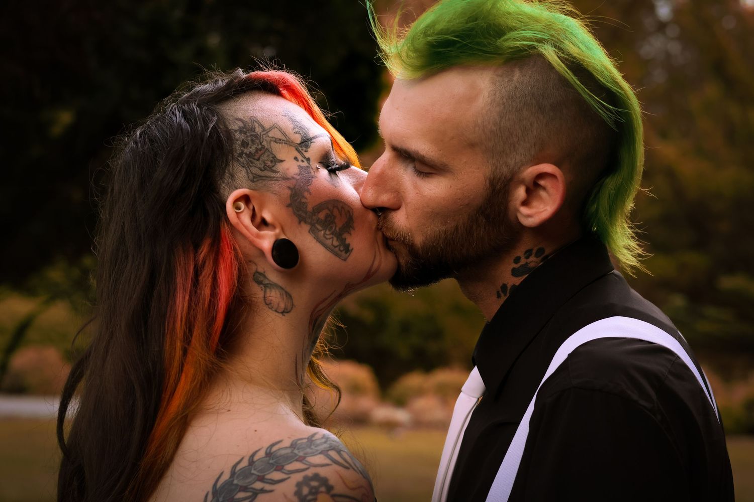 A romantic wedding couple shares tender kisses in multiple outdoor portrait shots with autumn foliage in the background.