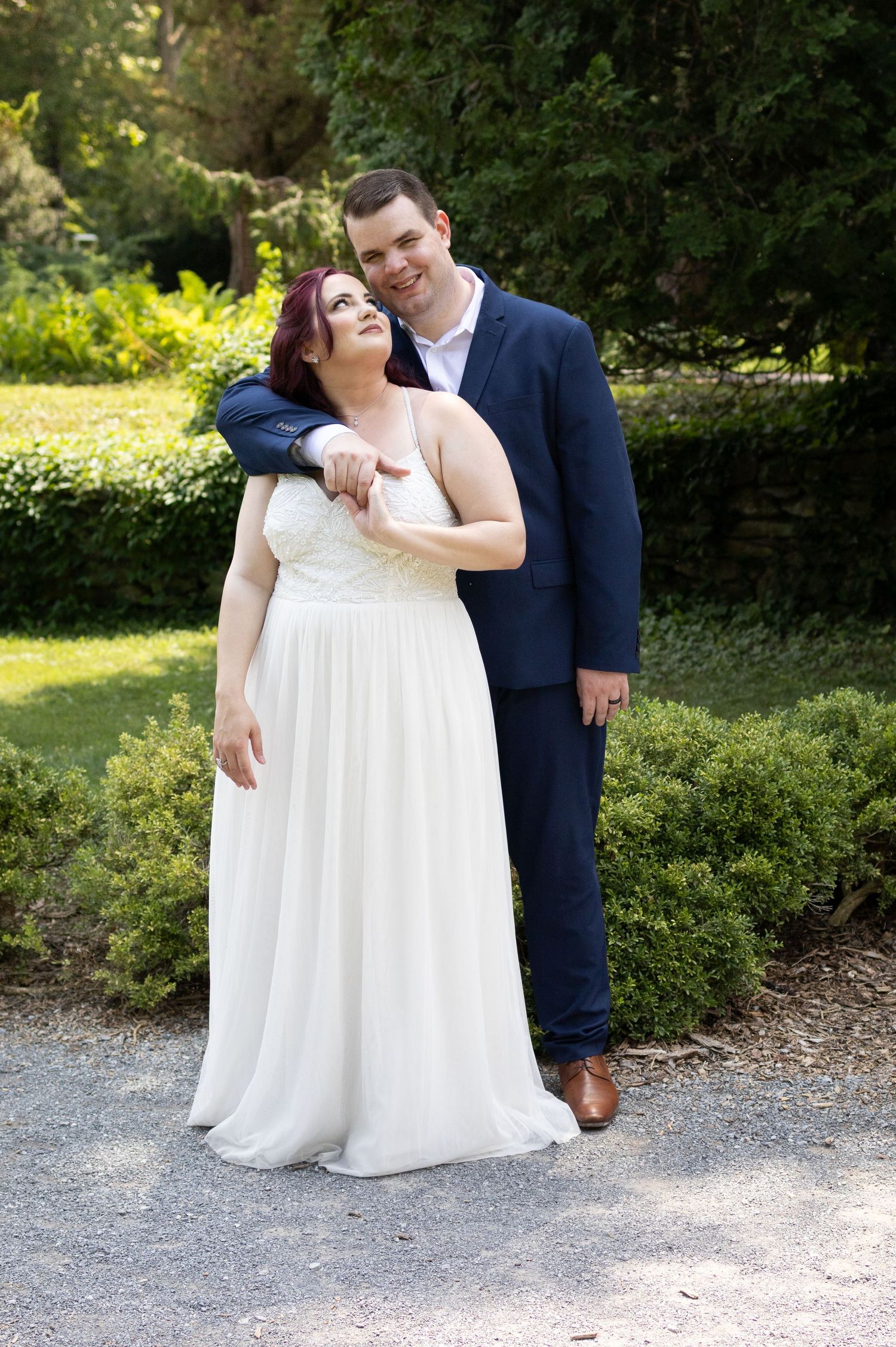 A romantic outdoor wedding photo sequence shows a couple in formal attire sharing intimate moments on a gravel path.