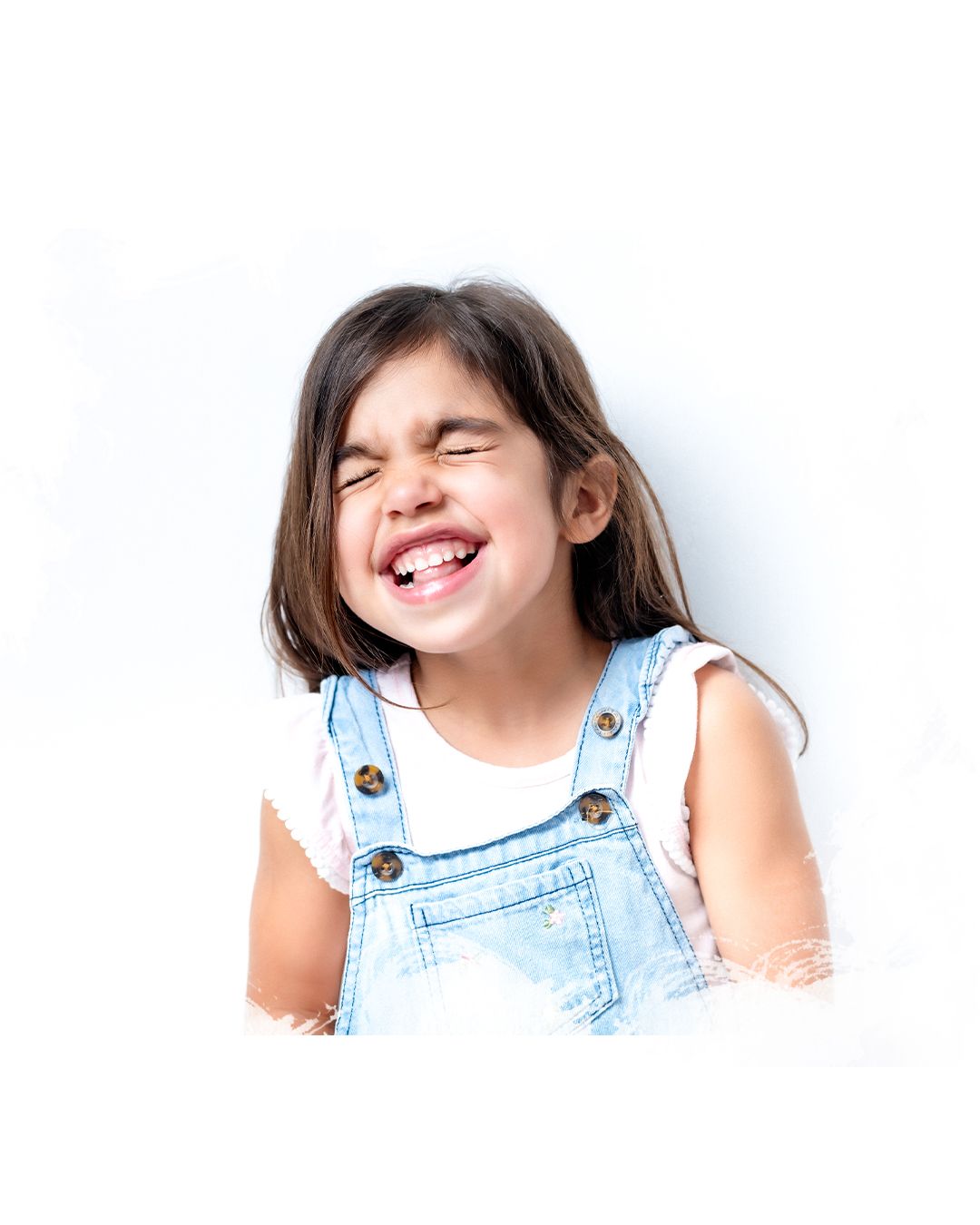 A smiling child wearing light denim overalls is shown in four playful poses against a white background.