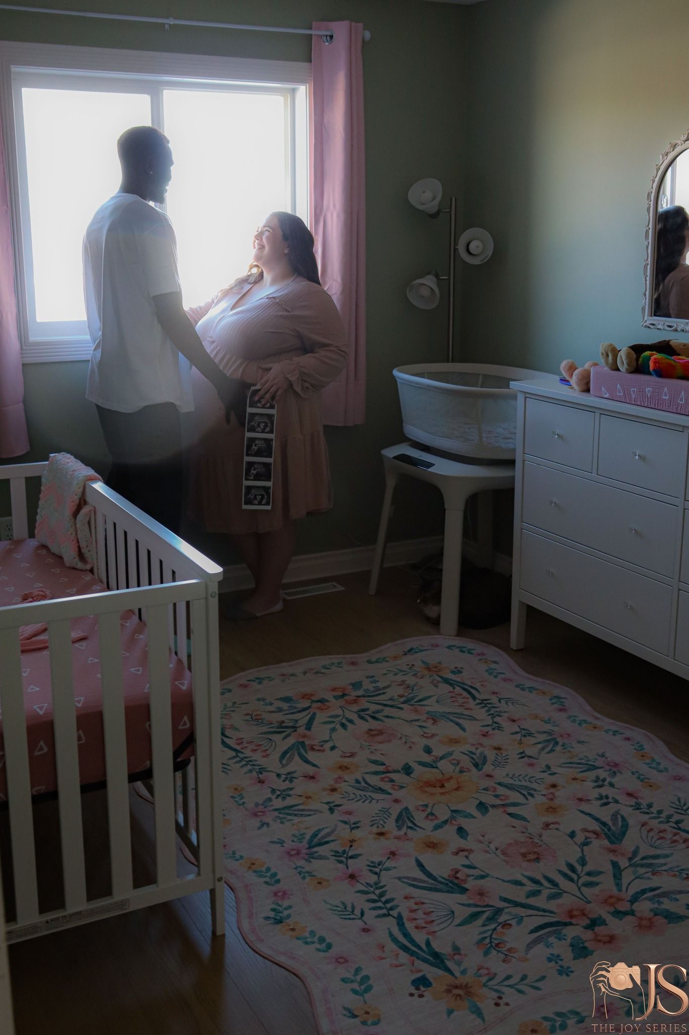 A series of photos showing the assembly of a white crib in a nursery room with floral patterned carpeting.