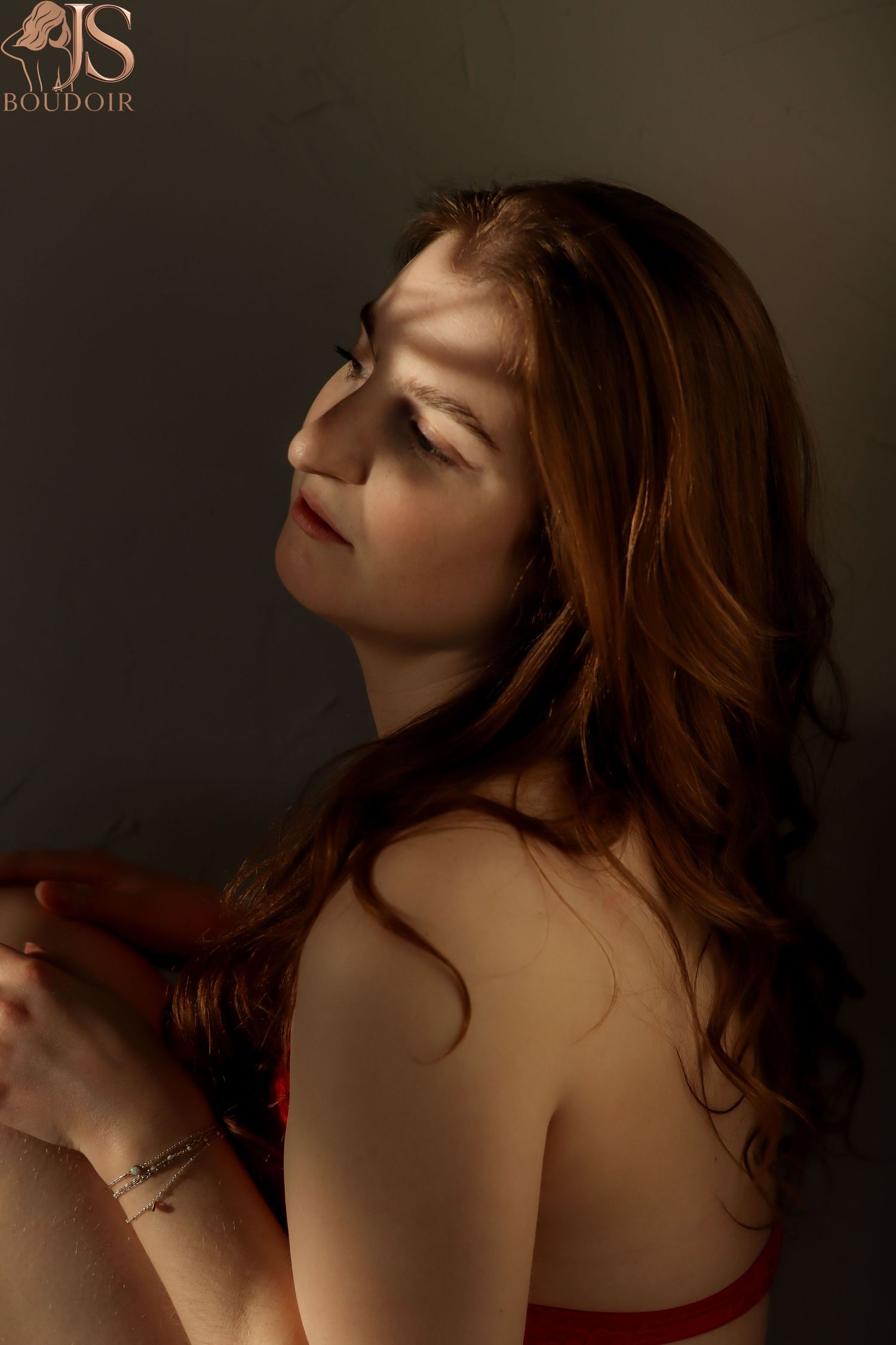 Intimate boudoir photography series with warm tones and soft lighting creating a sensual mood.
