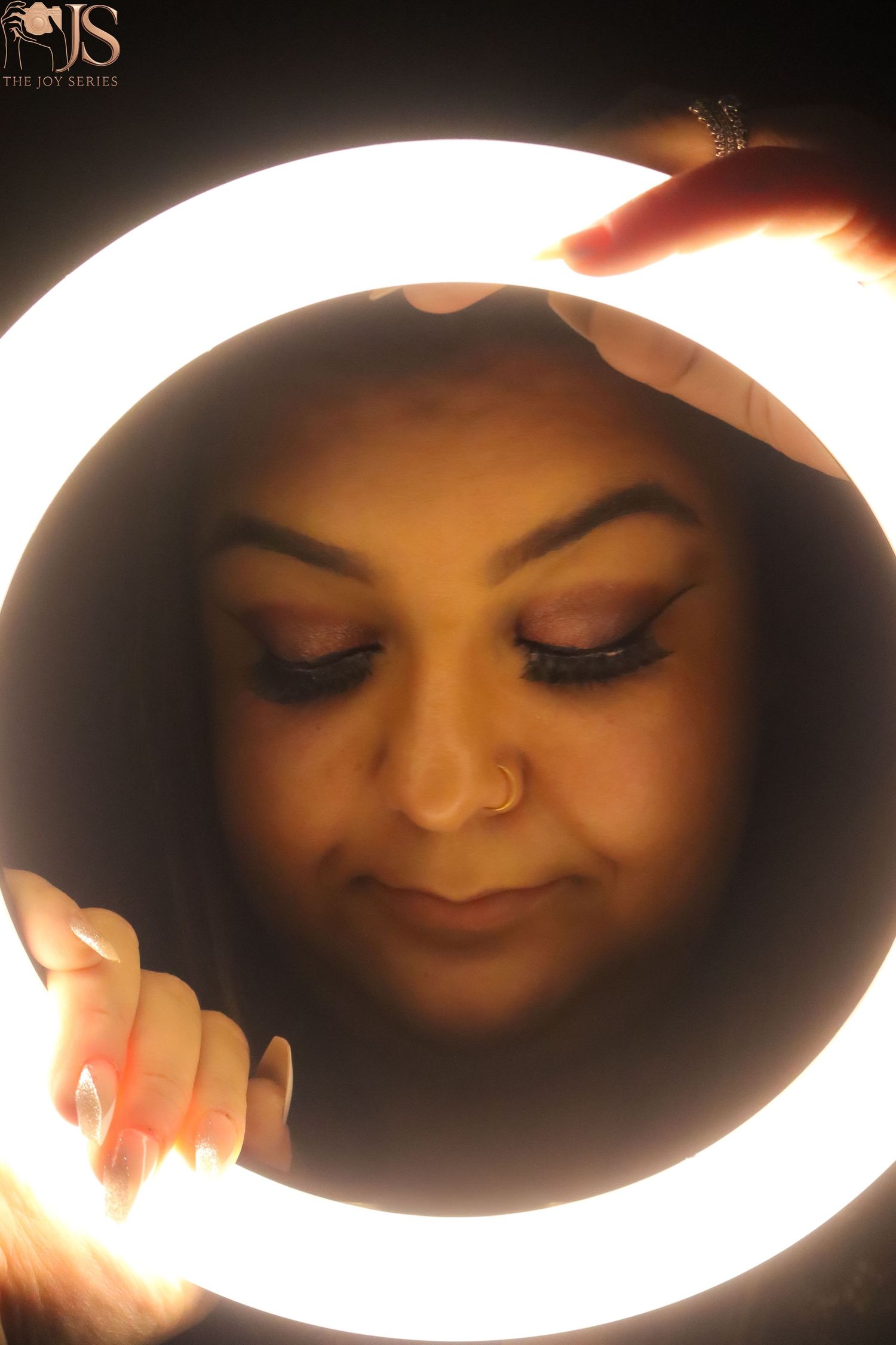 Dramatic oval-framed portraits with warm backlighting creating a glowing halo effect.