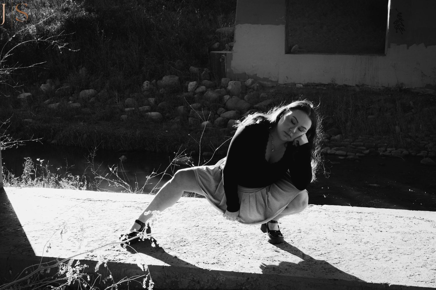 High contrast black and white photo showing dramatic shadows on a textured surface.