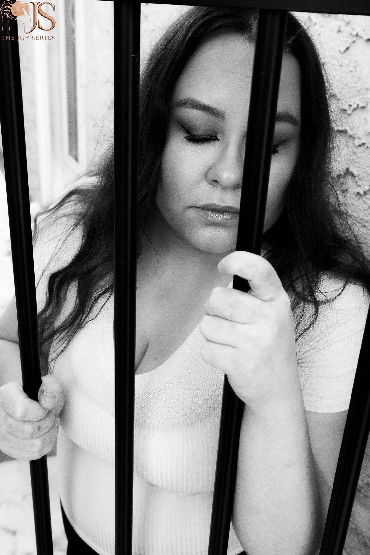A black and white artistic portrait series showing different poses through vertical bars in a dreamy style.