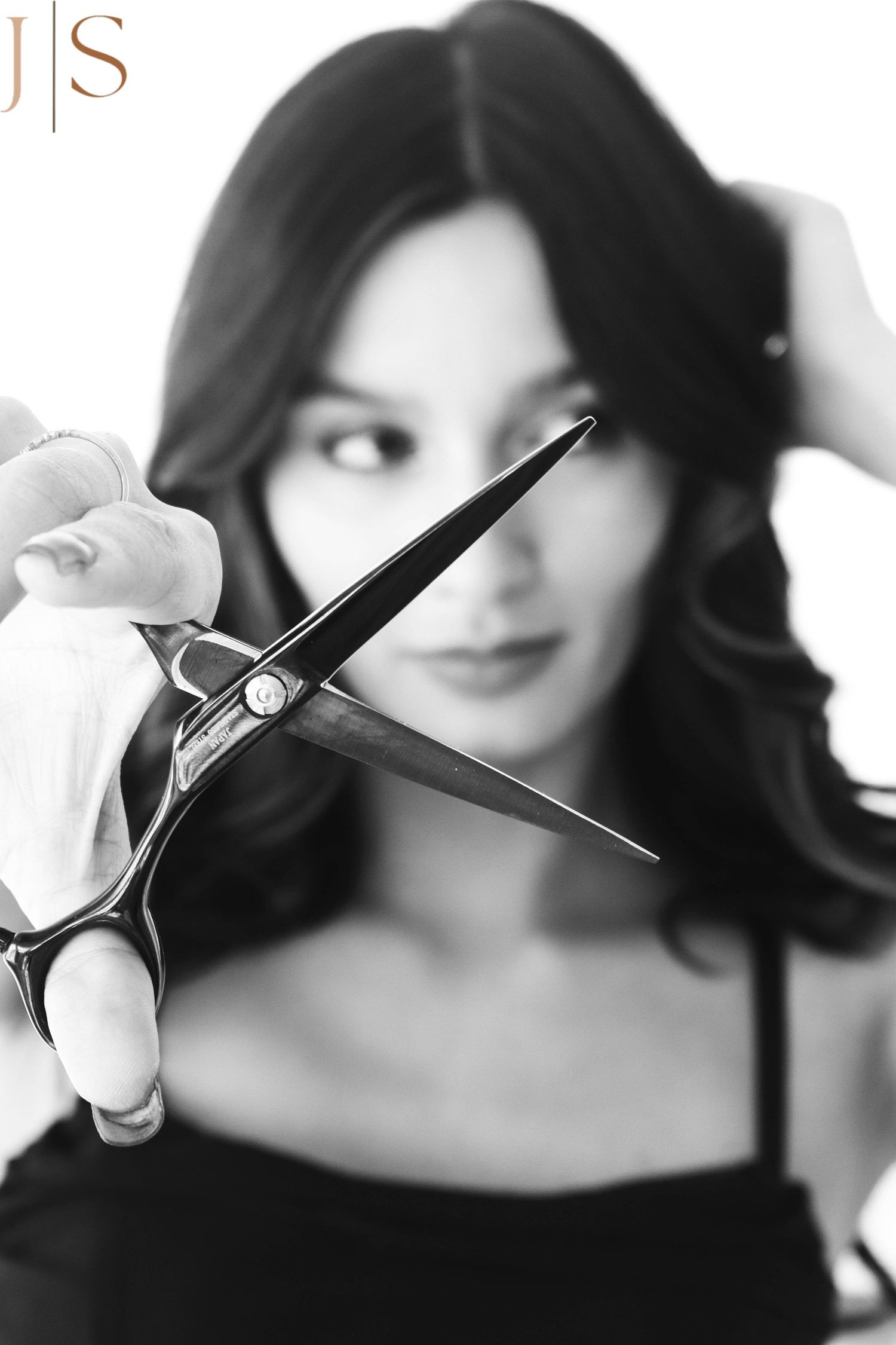 Black and white portrait series showing the same person in different dramatic poses with styled hair.