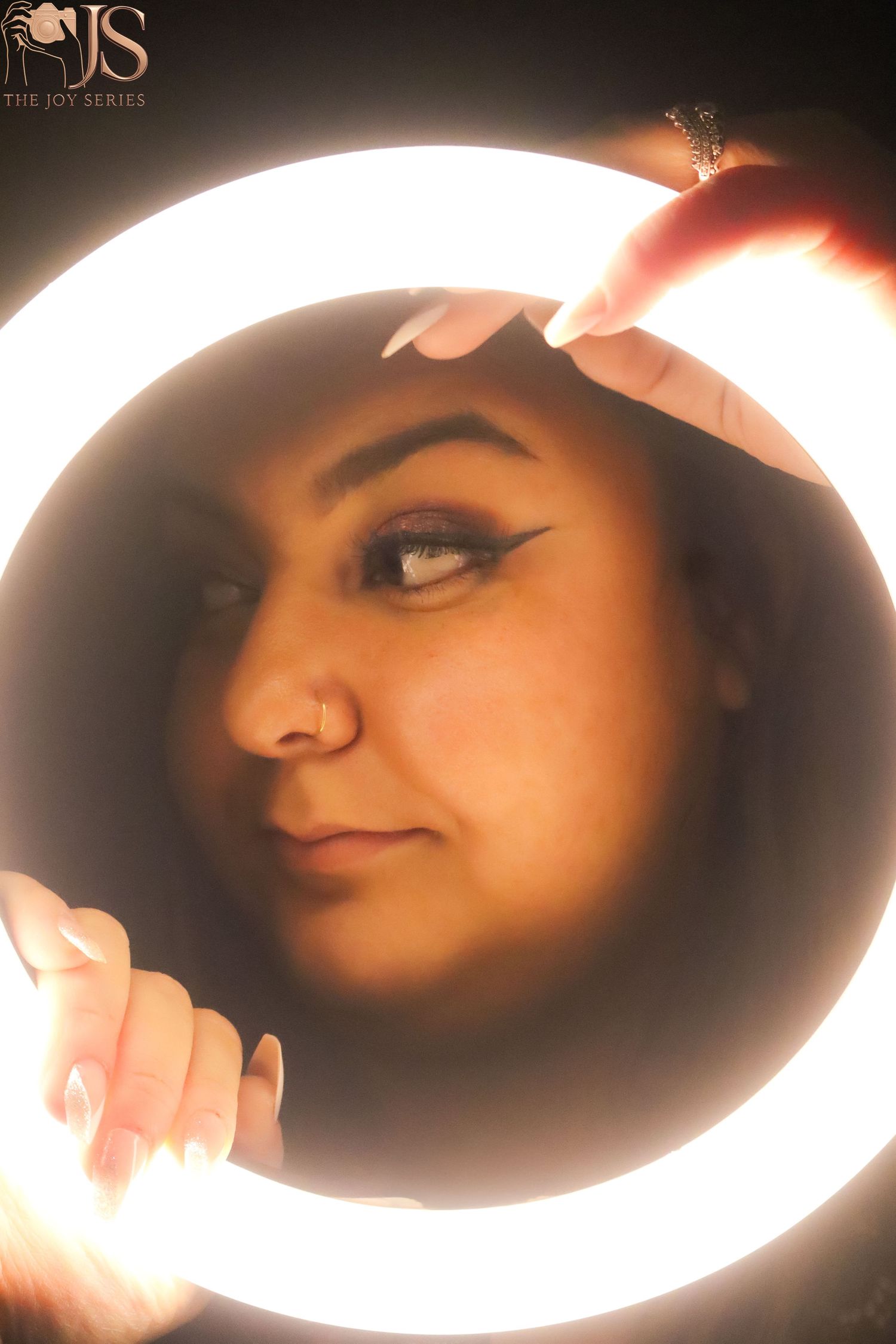 Close-up artistic portraits in dramatic lighting showing different angles of eye makeup and facial features.