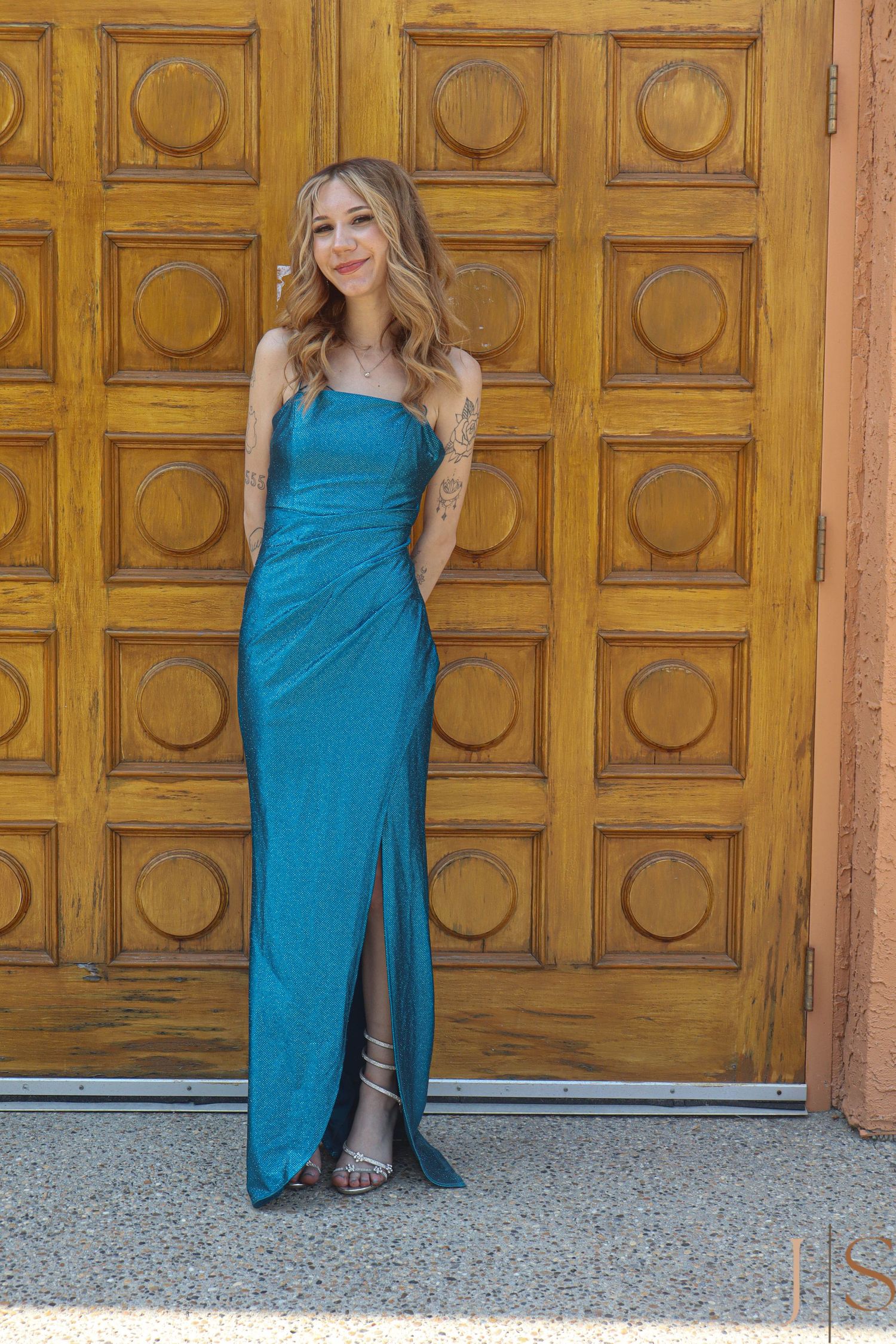 Person in turquoise dress poses against ornate wooden doors in series of artistic shots.
