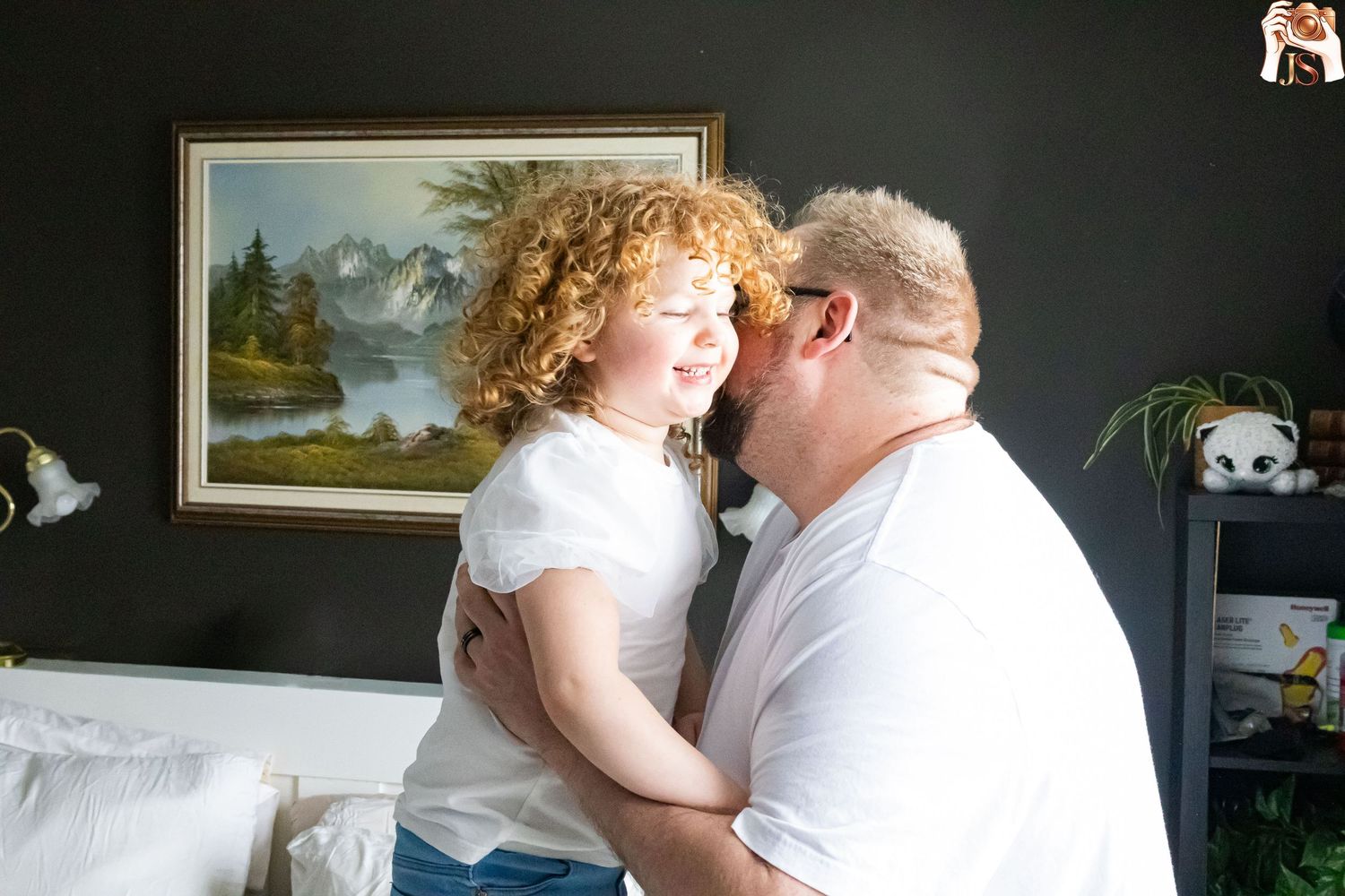 A couple shares an intimate dance moment together in formal wedding attire during their special celebration.