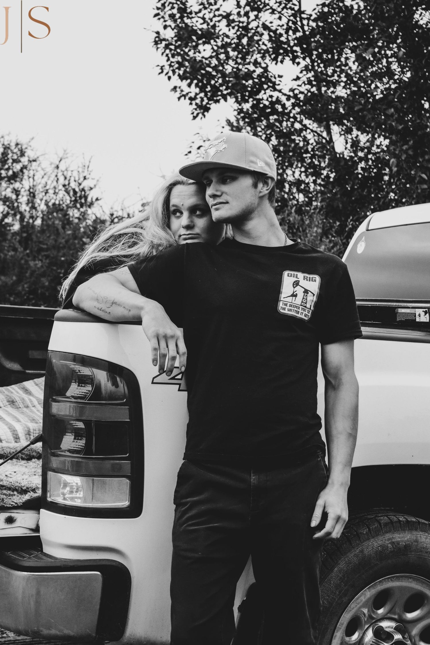 Black and white photo series showing cropped views of a person in dark clothing leaning against a white vehicle.