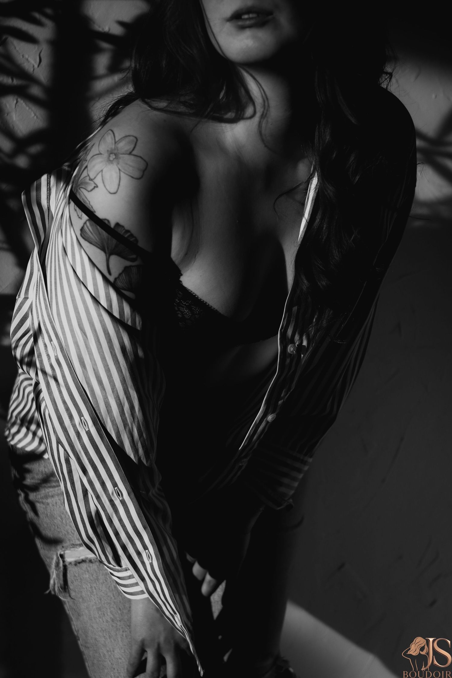 Dramatic black and white portrait series featuring striped fabric and artistic lighting effects.