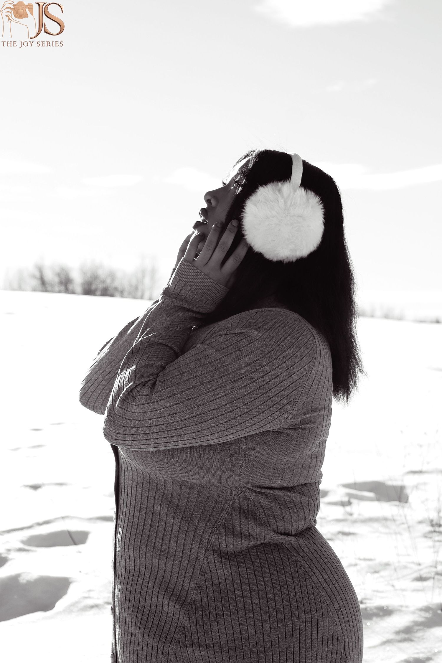 Multiple black and white portraits showing someone wearing a ribbed sweater against a snowy background.