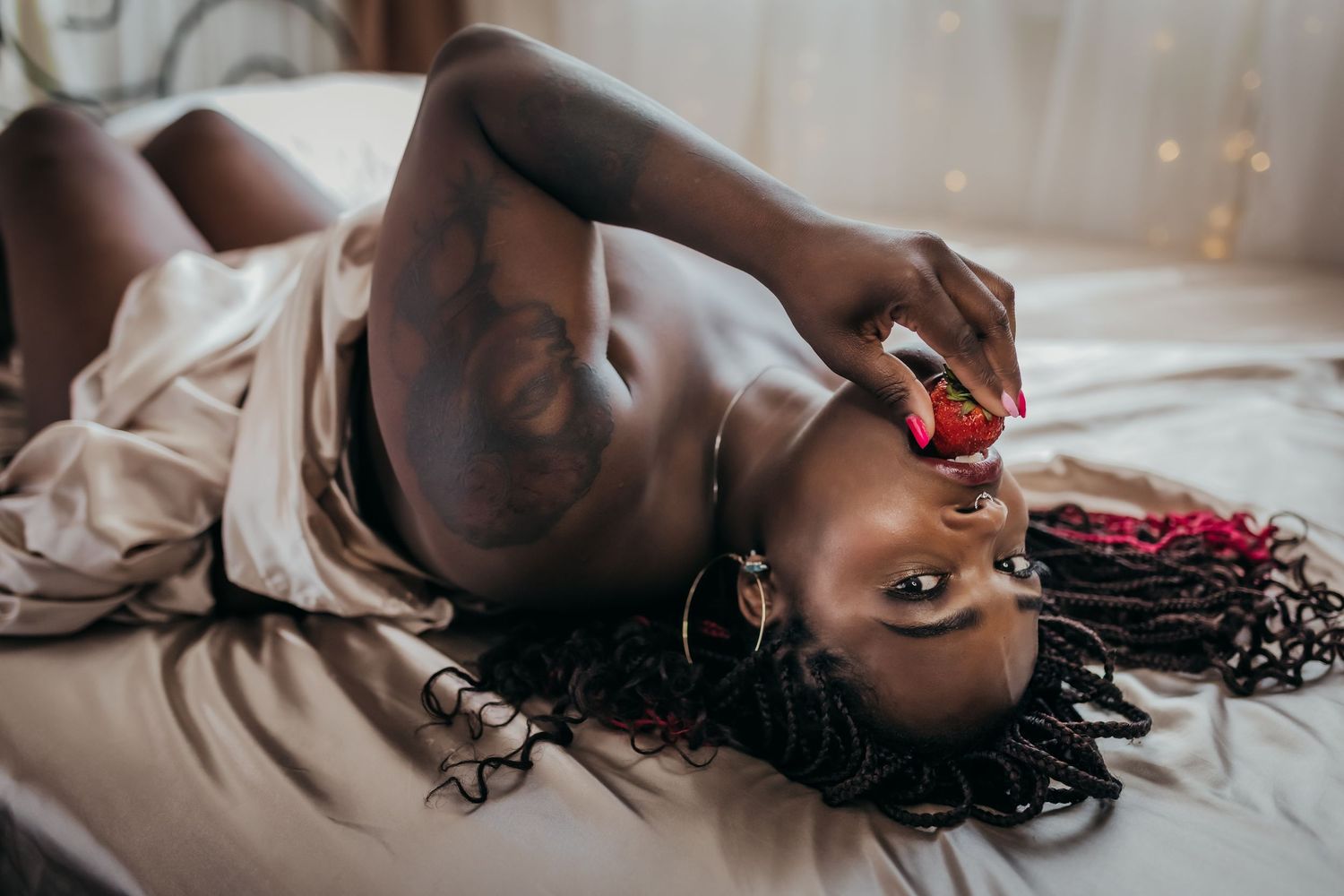 A sequence of romantic boudoir portraits showing couple embracing in soft natural light on white bedding.