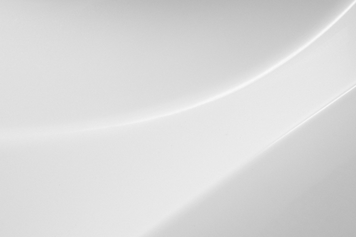 Abstract white curved lines on light gray background creating a minimalist design.