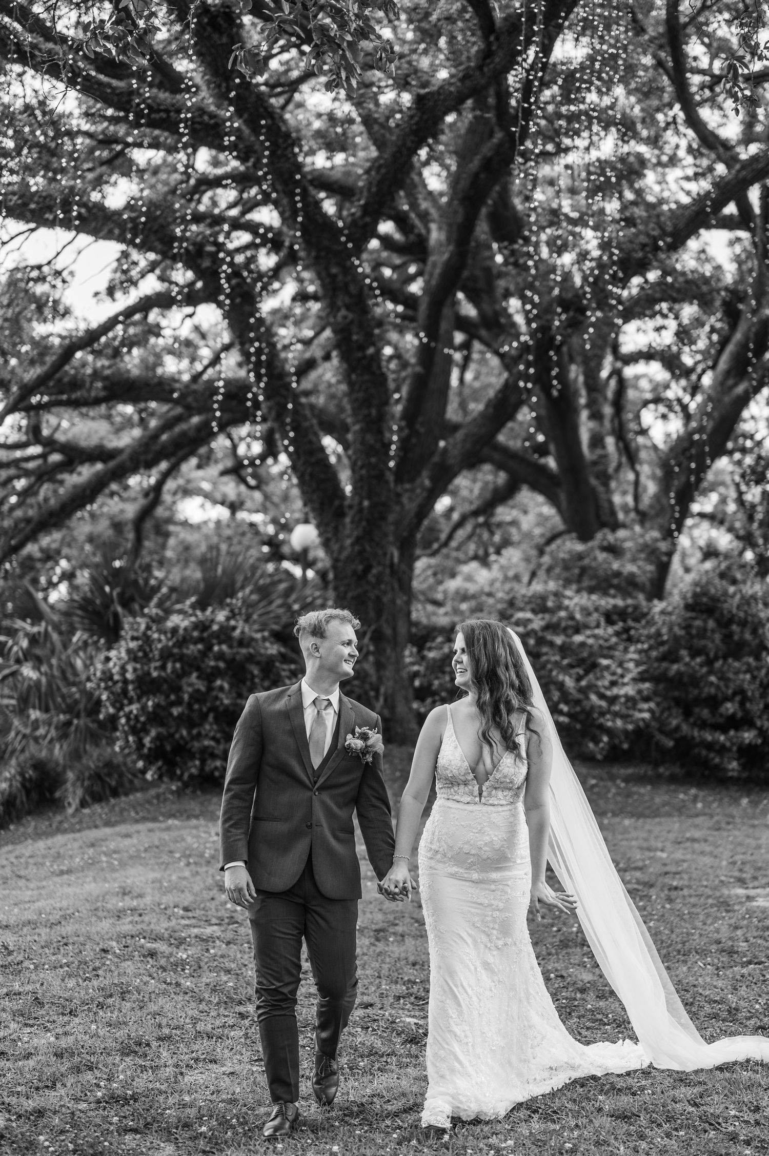 Bride and groom sharing a romantic walk in Charleston south Carolina