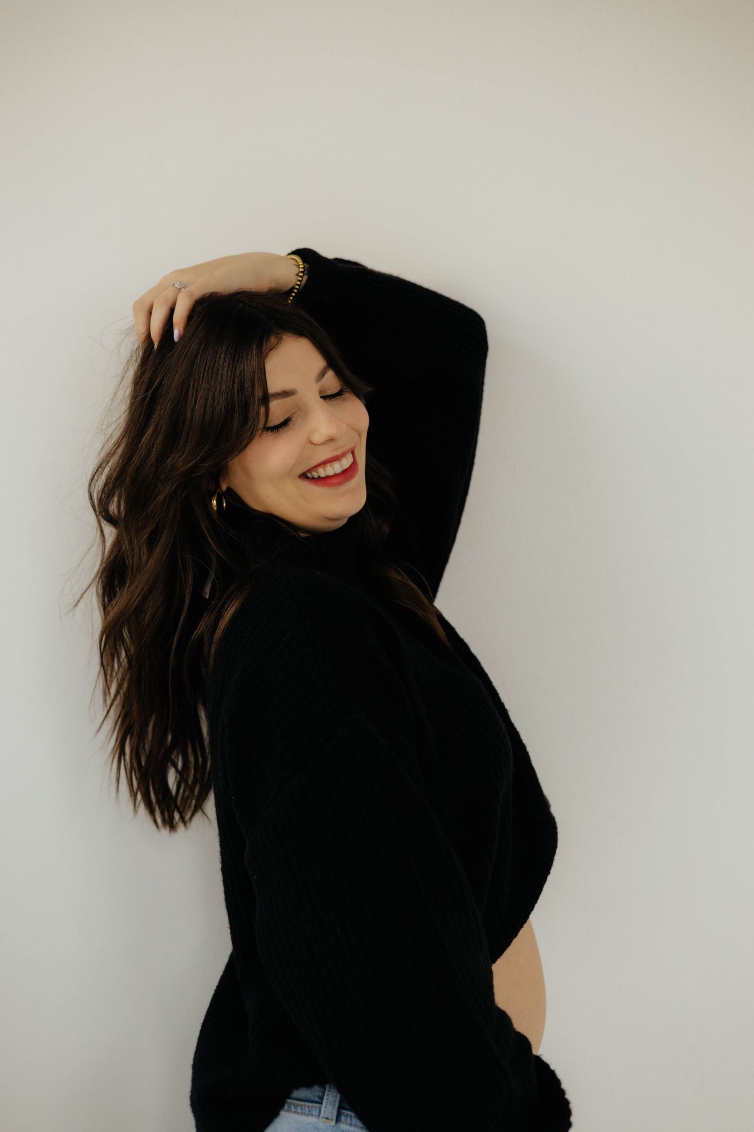 Dynamic self portraits of someone in black clothing against a white background.