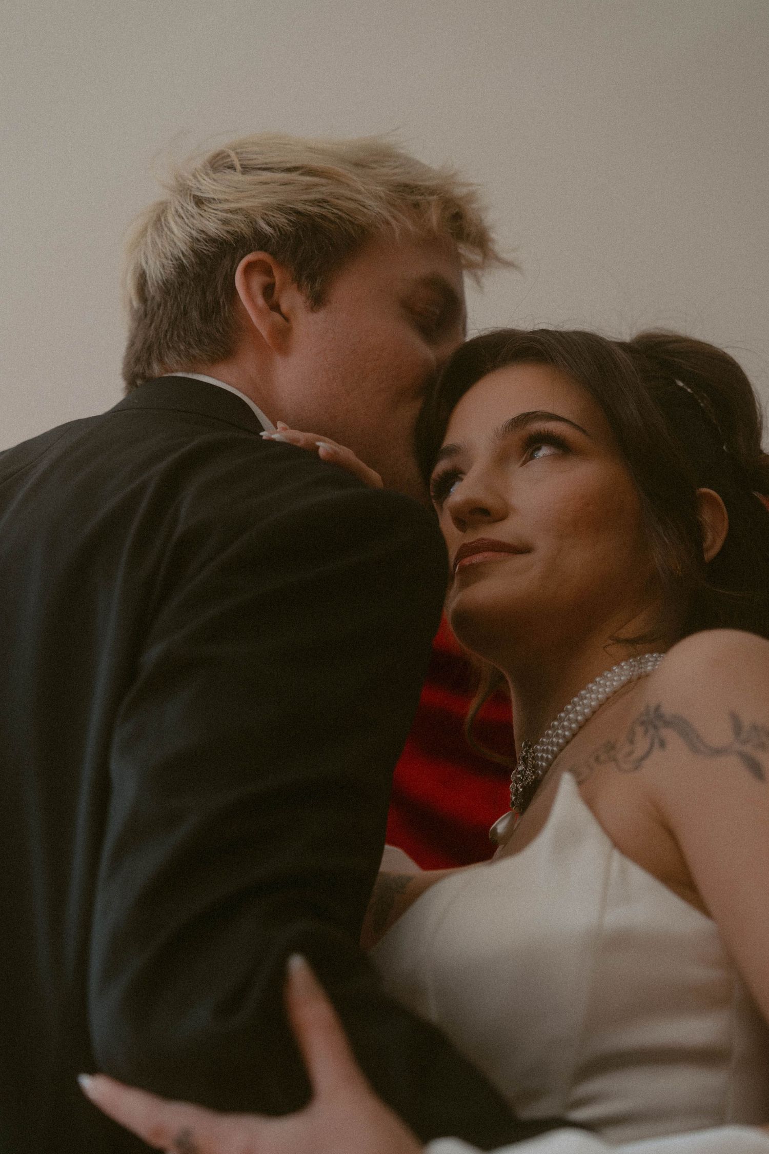 Bride and groom in an intimate embrace, gazing at each other