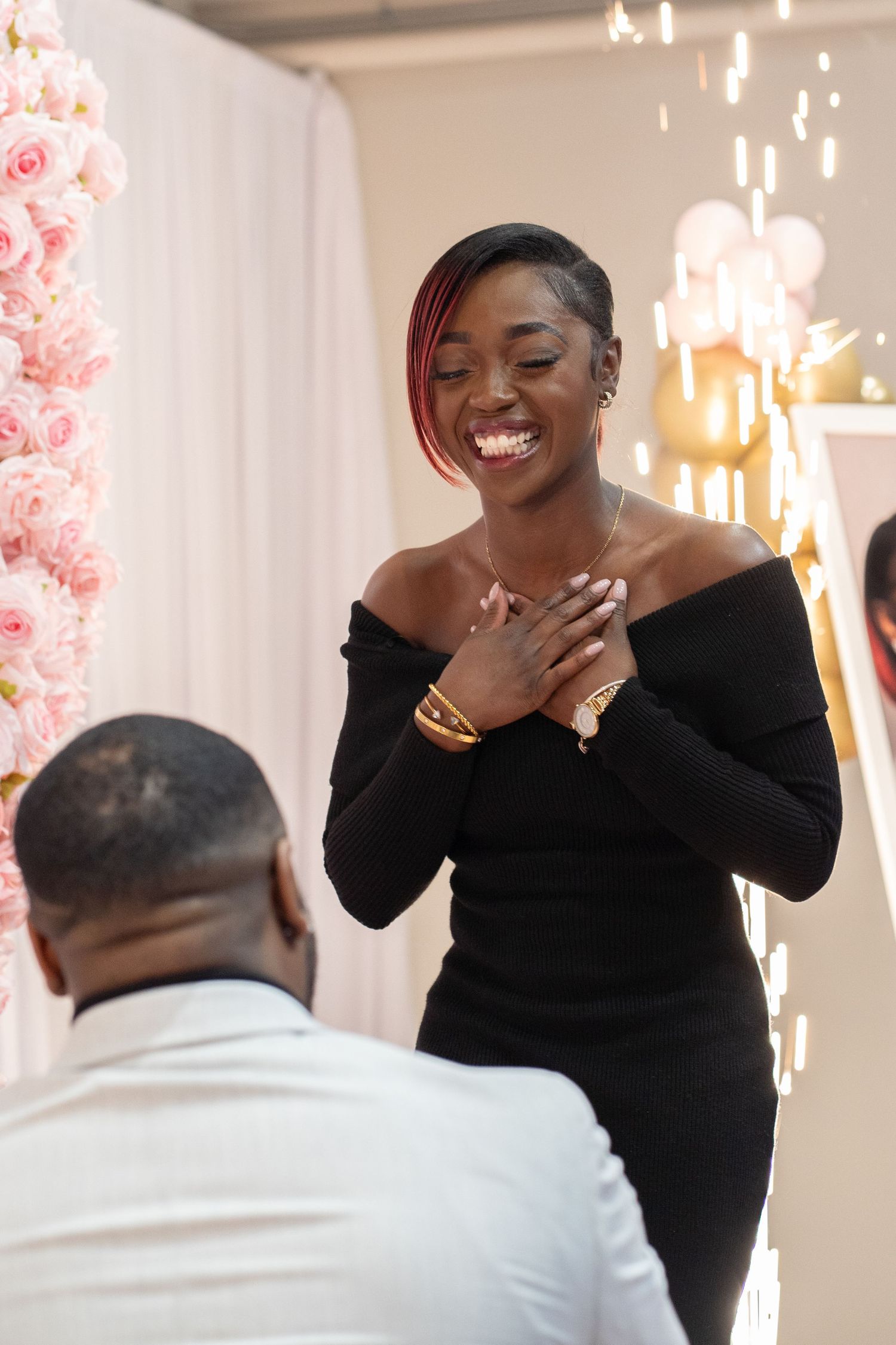 Candid moments of joy and surprise during romantic proposal.