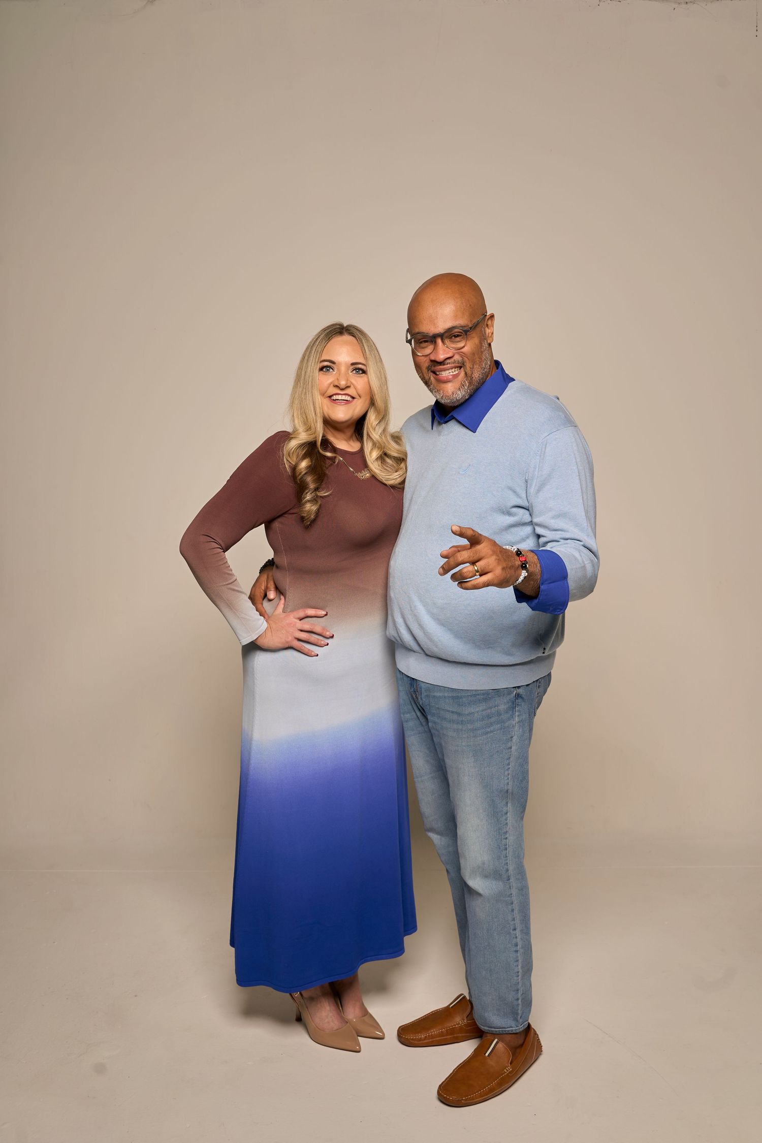 Studio portrait session featuring casual poses in coordinated winter outfits.