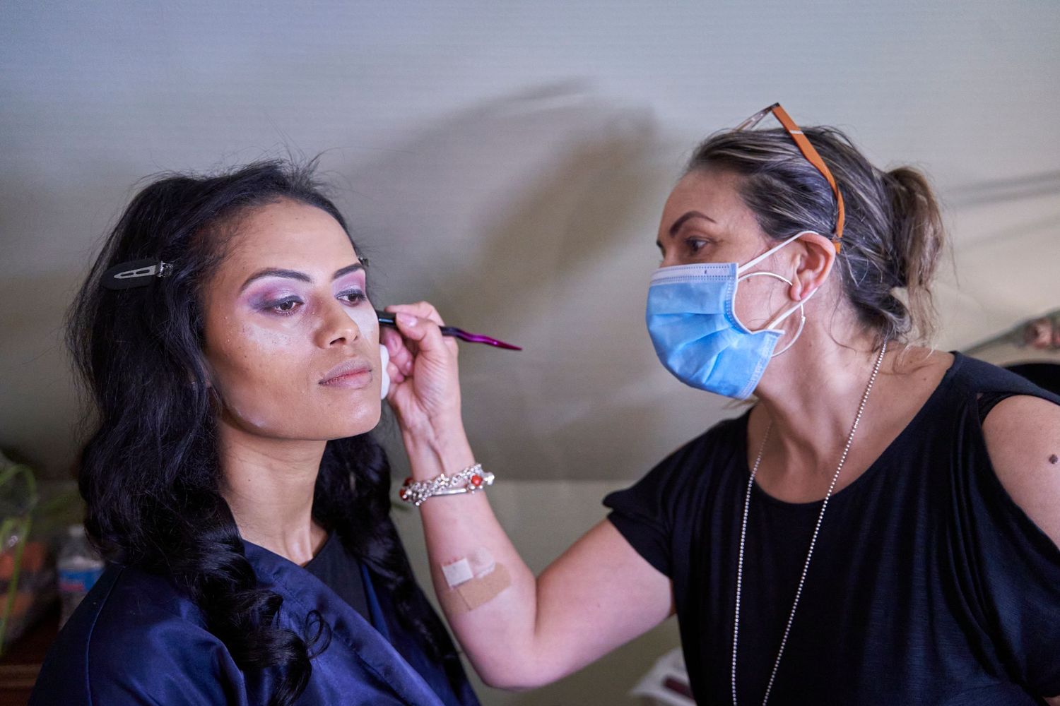 Behind-the-scenes makeup application sequence in preparation for an event.