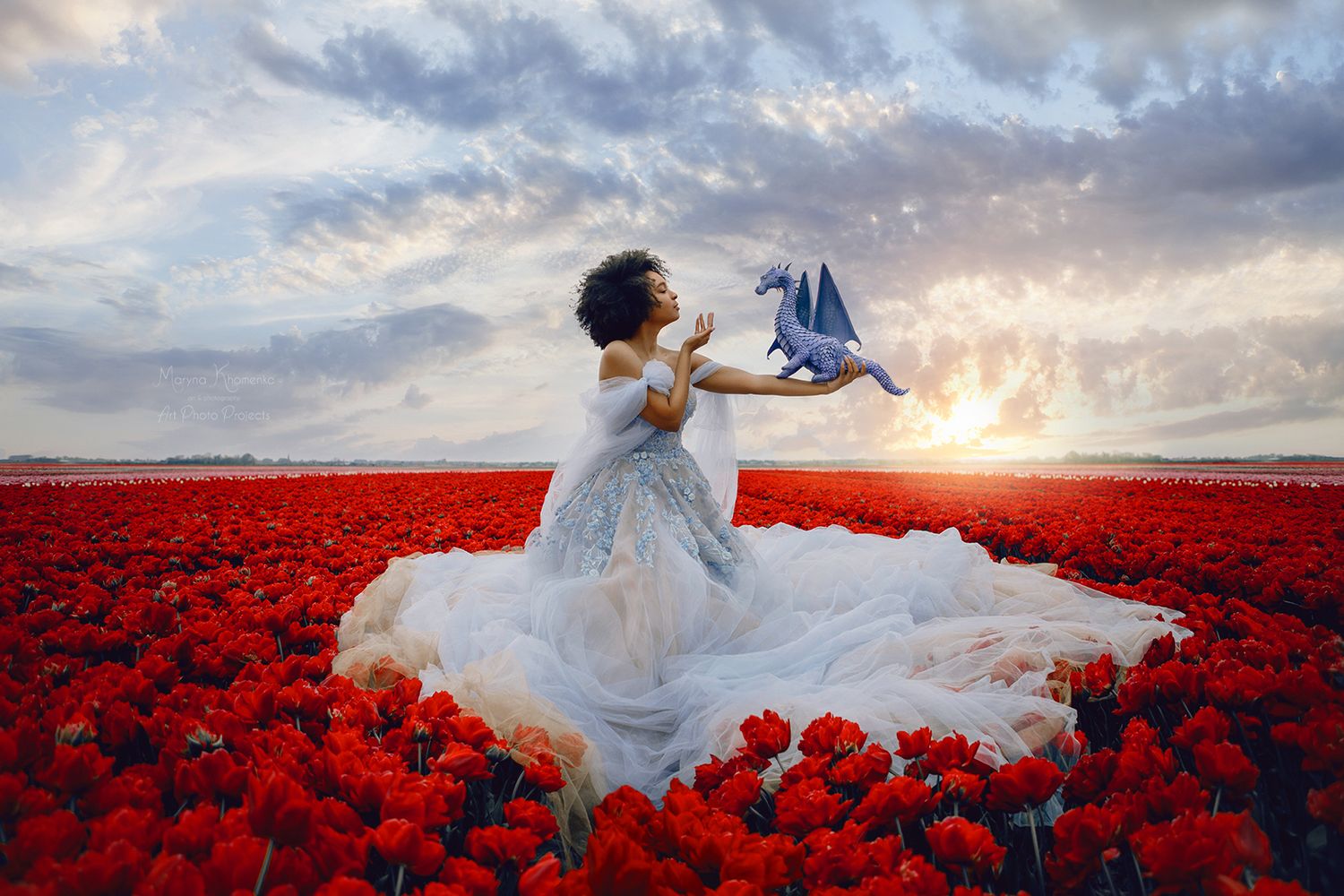 Ethereal bridal photos in flowing white dress against dramatic red flower field at sunset.