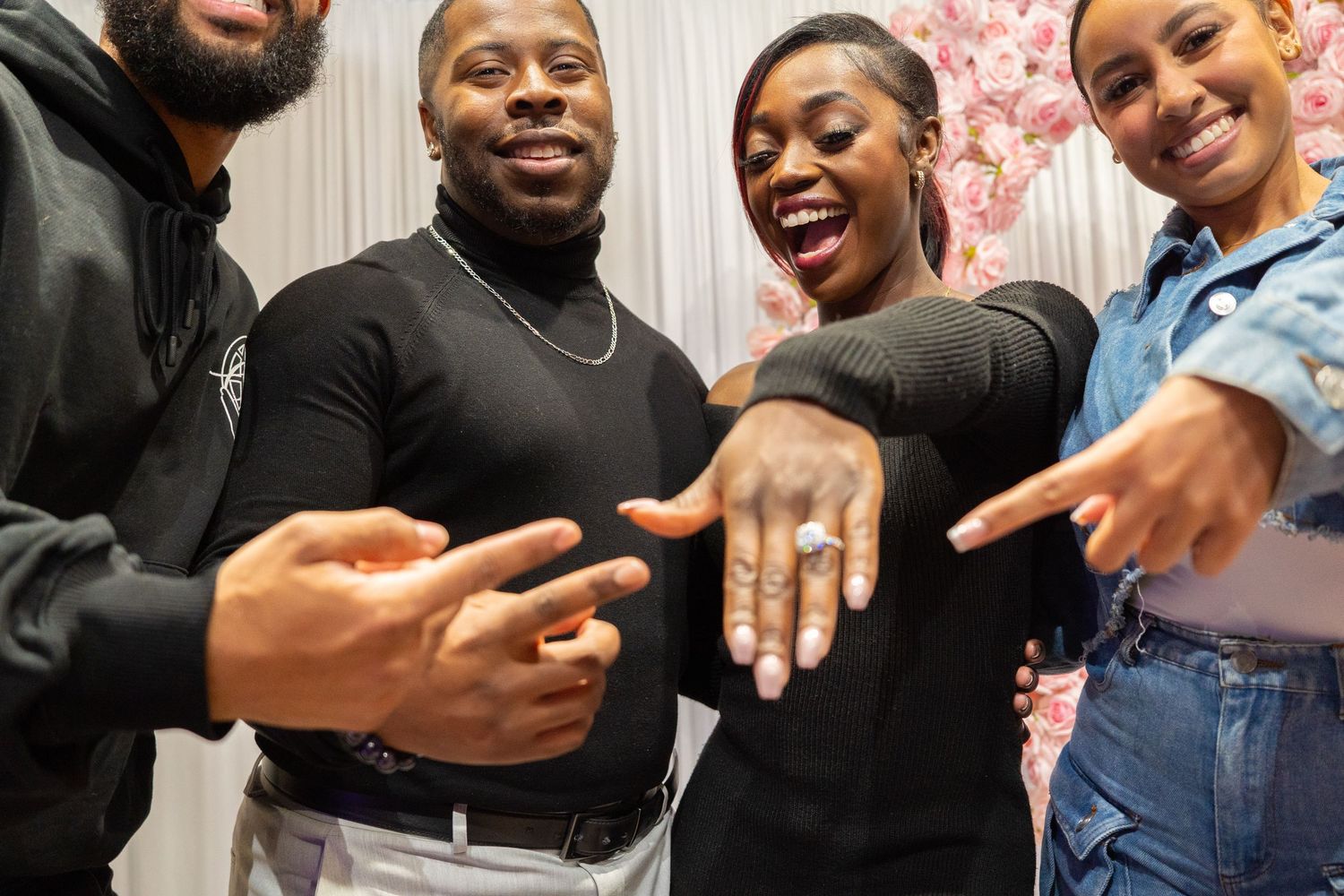 Happy celebratory moments shared between friends after proposal.