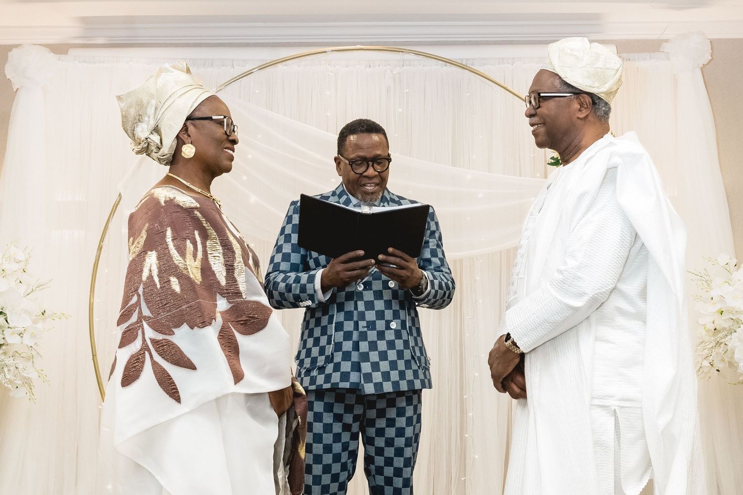 Wedding celebration with guests in traditional African attire dancing and celebrating.