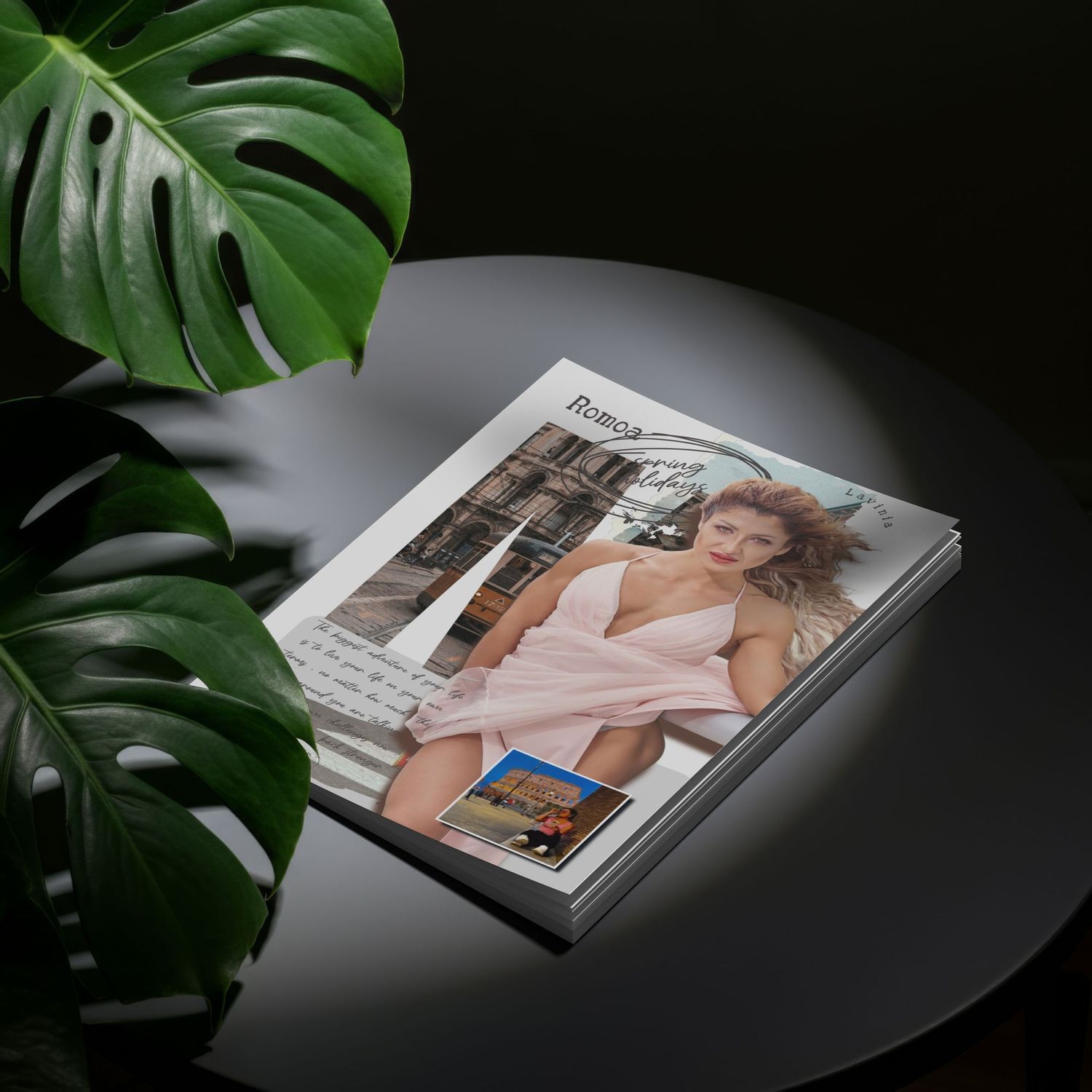 Professional photography portfolio book displayed with monstera leaves against dark background.