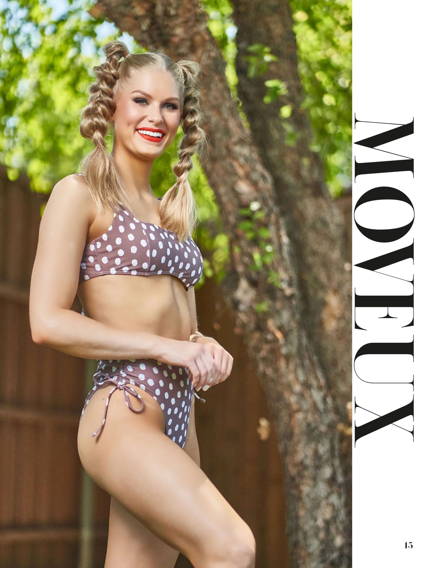 Outdoor fashion photography featuring polka dot swimwear against natural garden setting.