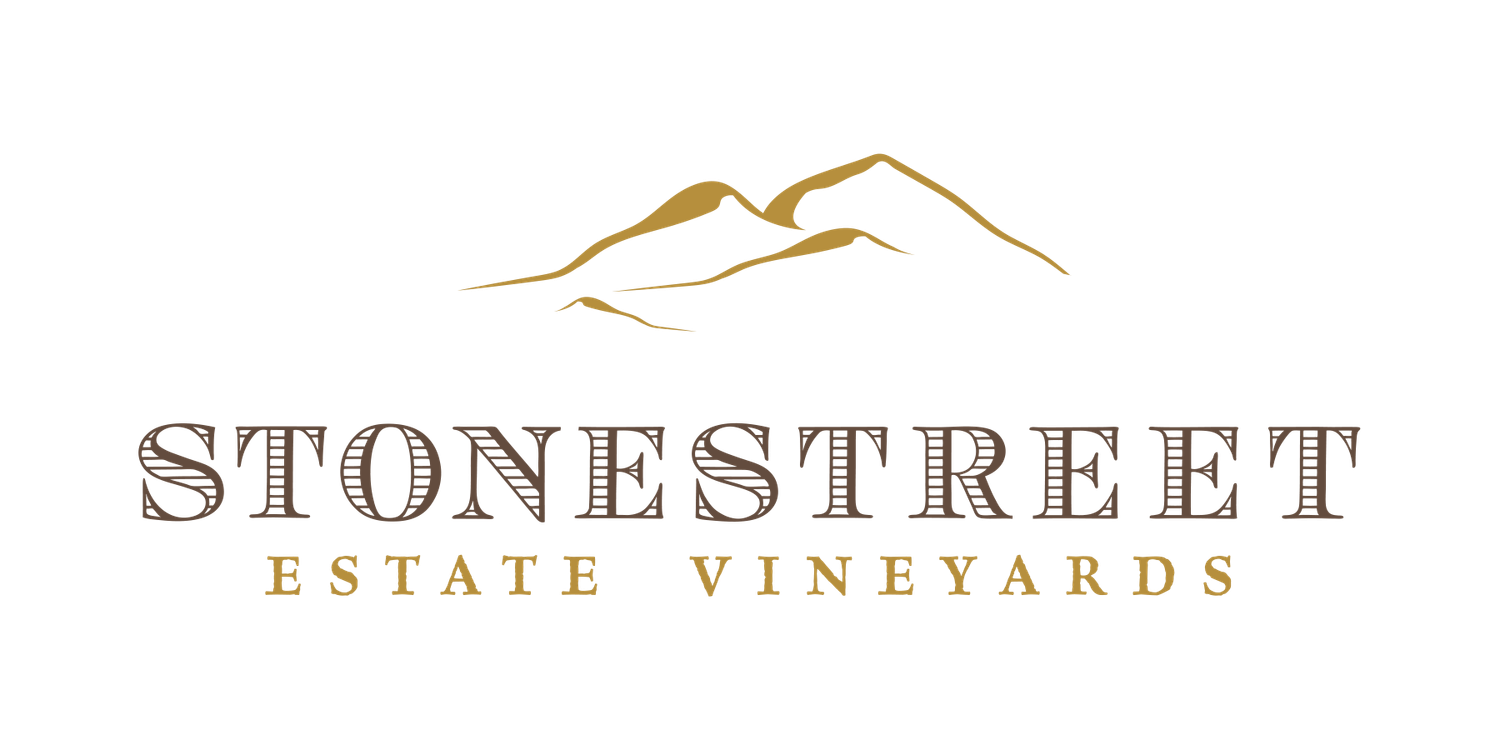 Stonestreet Estate Vineyards logo featuring brown text and mountain illustration.