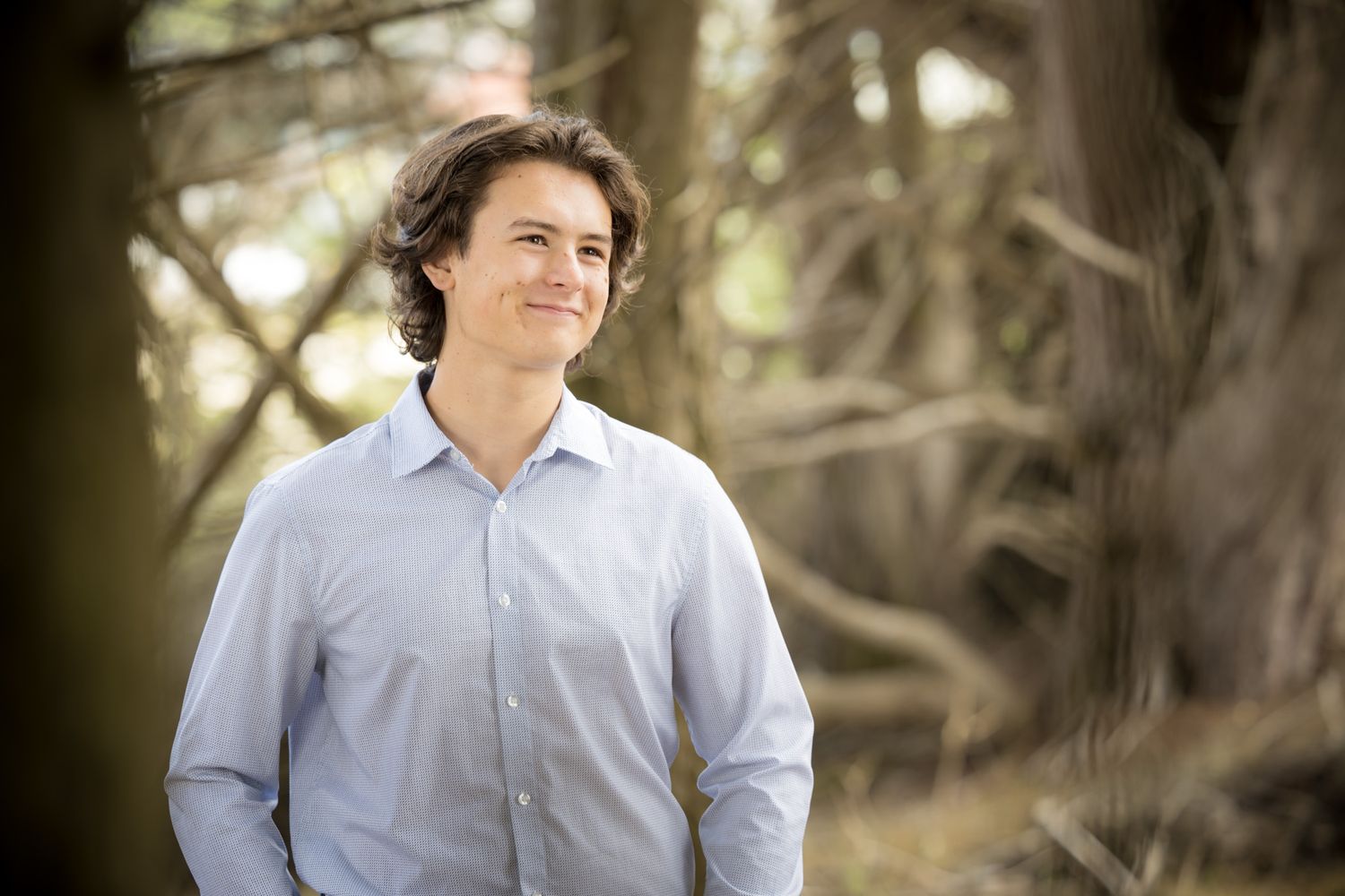 Natural light portrait series captured under tree canopy.