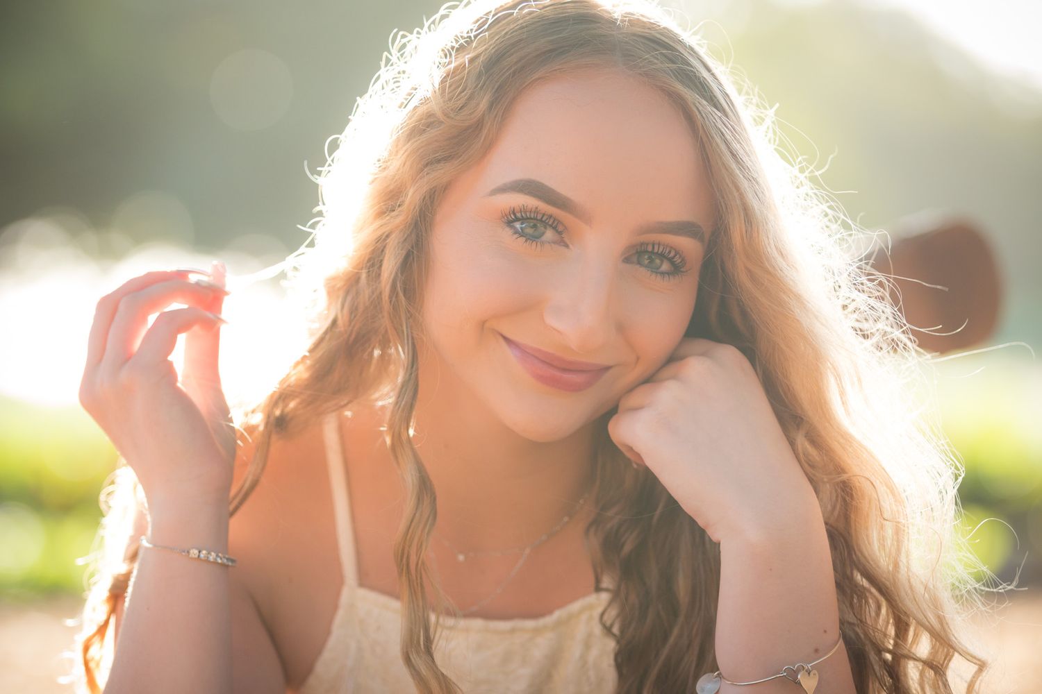 A sun-drenched outdoor portrait with warm golden hour lighting and soft natural glow.