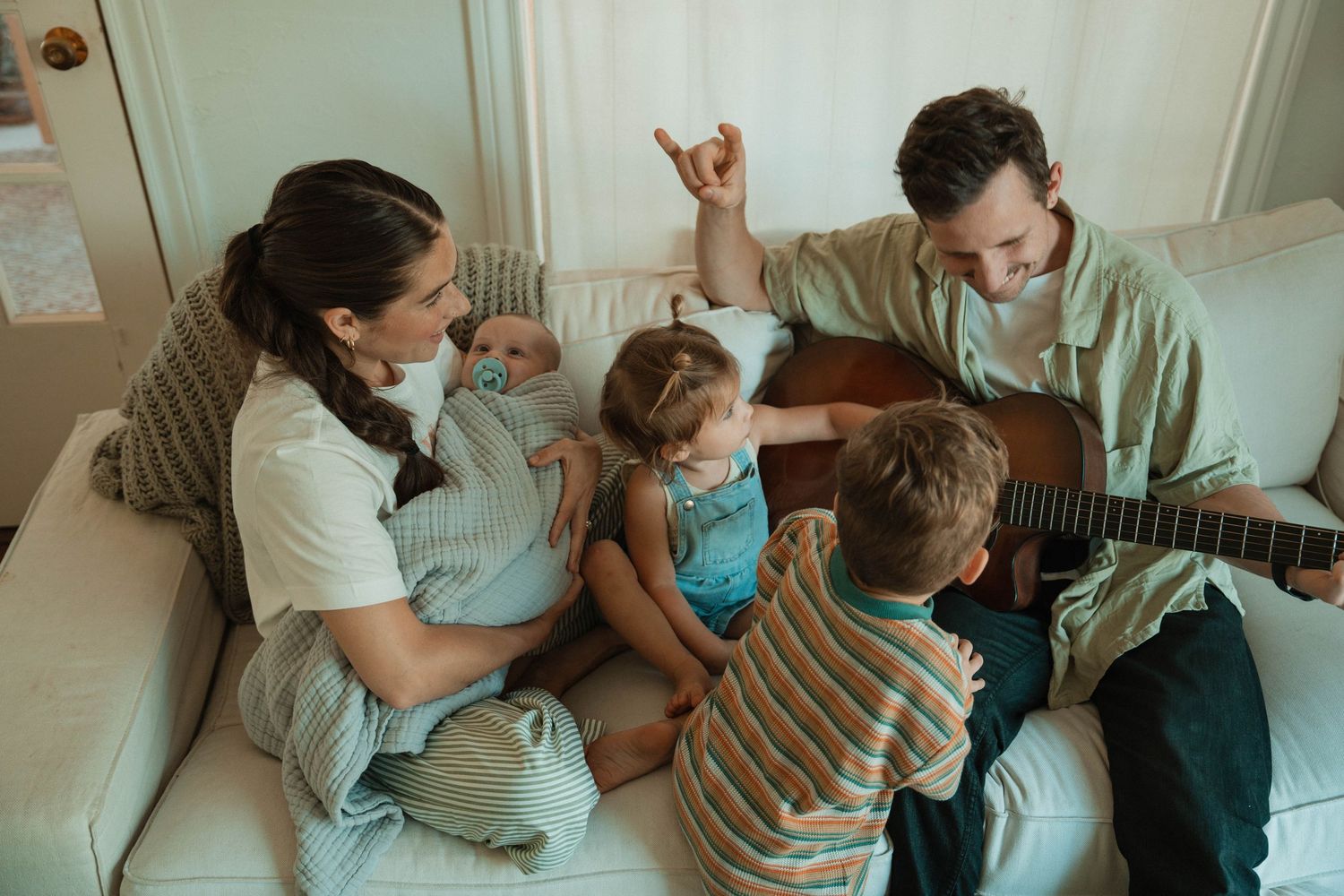 Joyful family playtime captured in a series of candid moments at home.