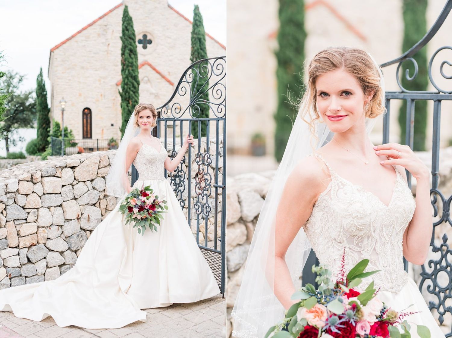 A bride in a white strapless ball gown holds a colorful bouquet beside an elegant wrought iron gate and stone wall.