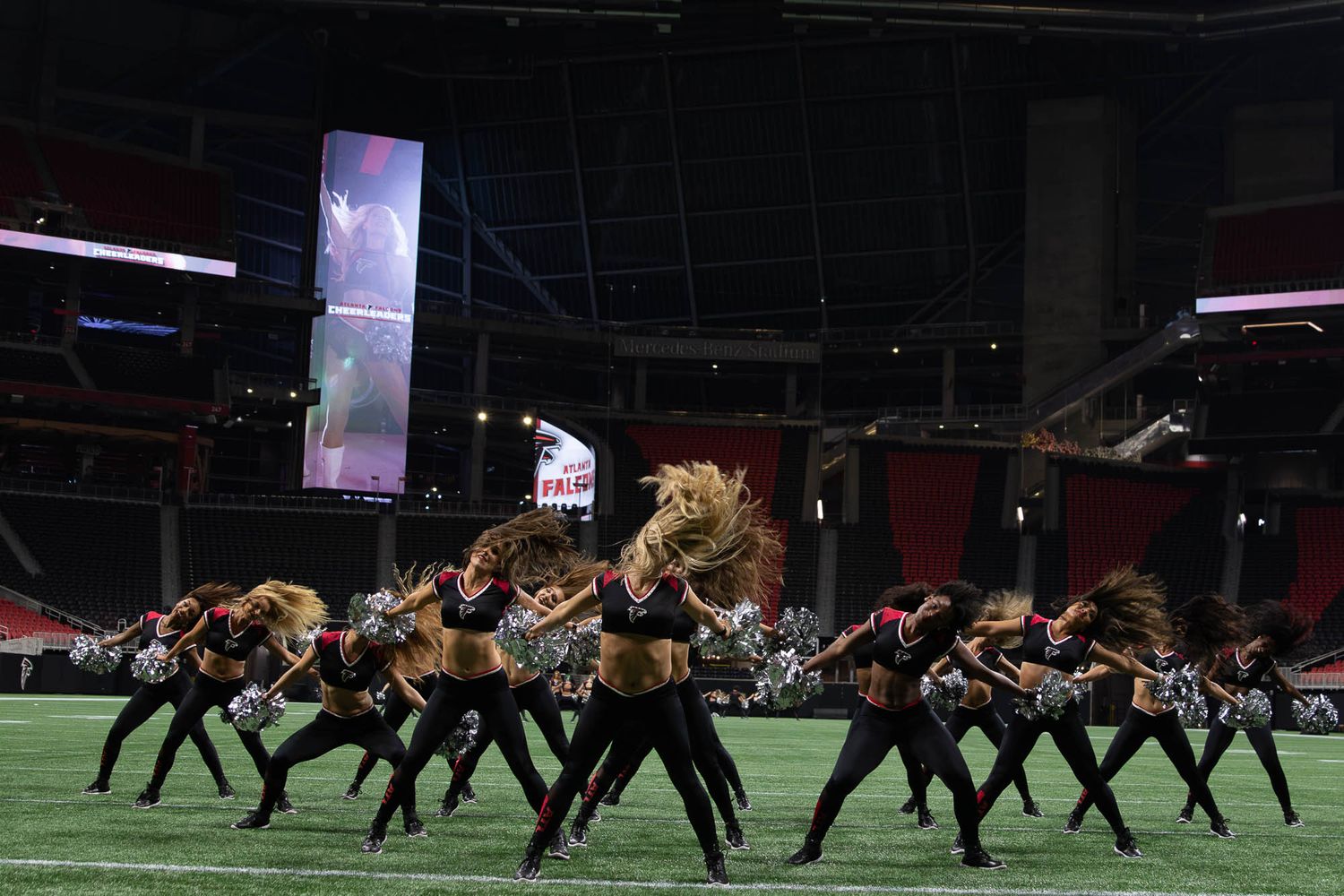 Atlanta Falcons Cheerleaders performing synchronized routine at the Mercedes Benz Stadium Atlanta, Georgia