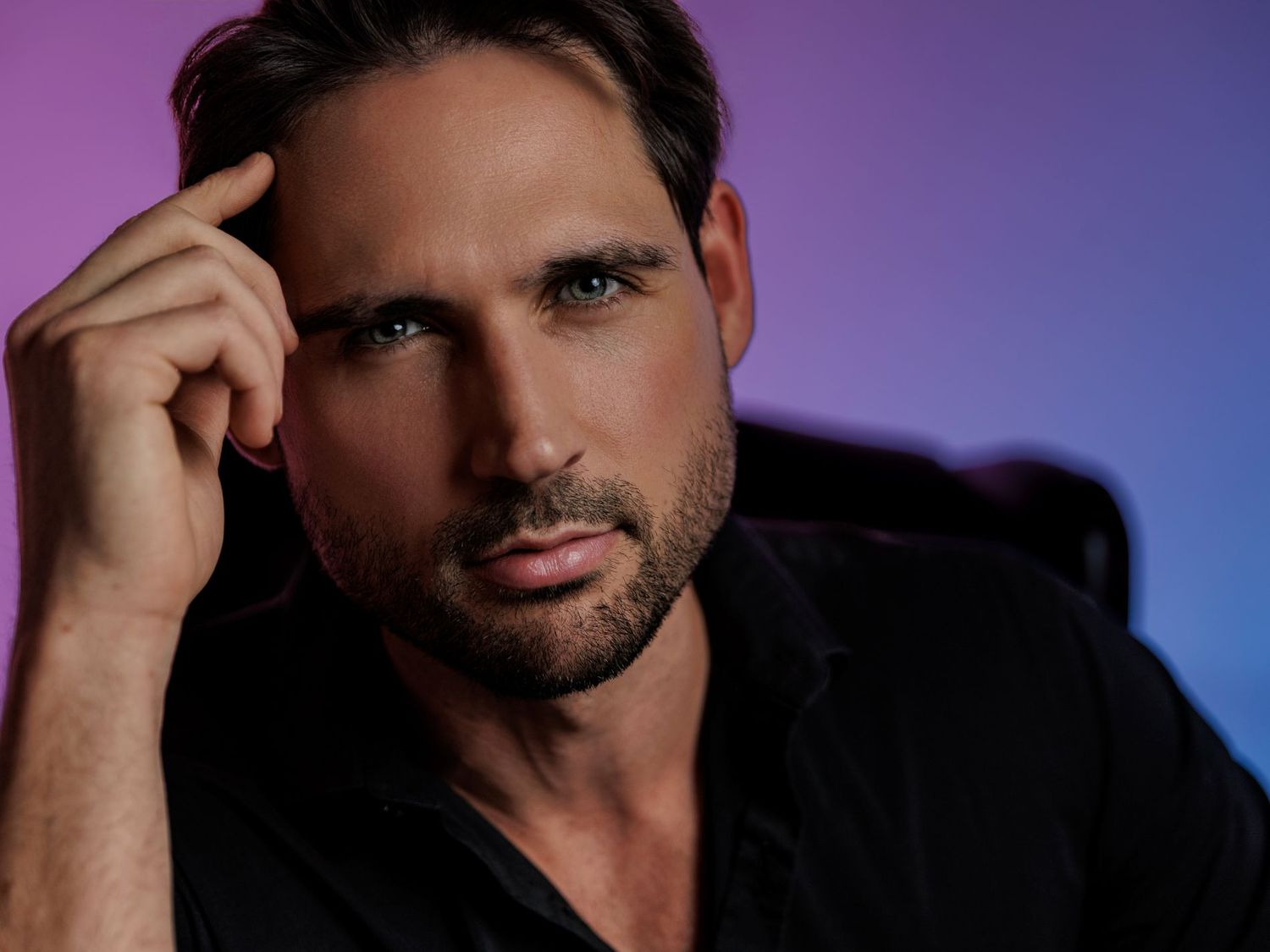 A series of headshots with dramatic lighting against a blue and purple gradient background.