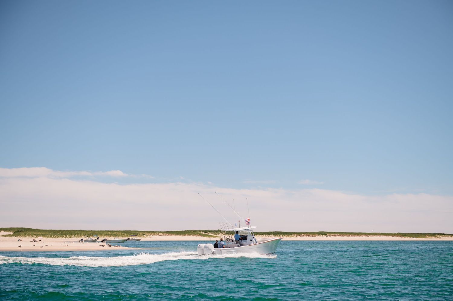 Fishing boat cruising through the ocean waters.