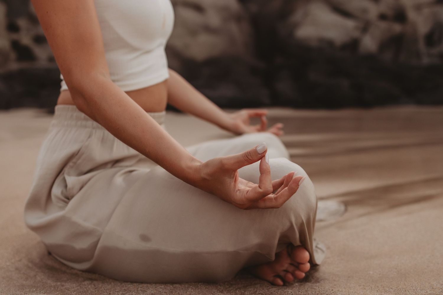 yoga Artful branding photo of a woman sitting in the shoreline surf.