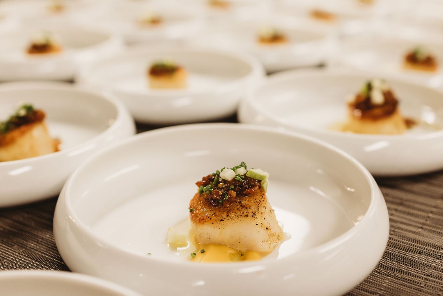 Gourmet scallop served on a plate with elegant presentation.