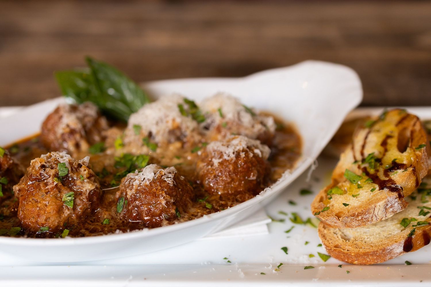 Gourmet meatball dish with grated Parmesan captured by Maui restaurant photographer.